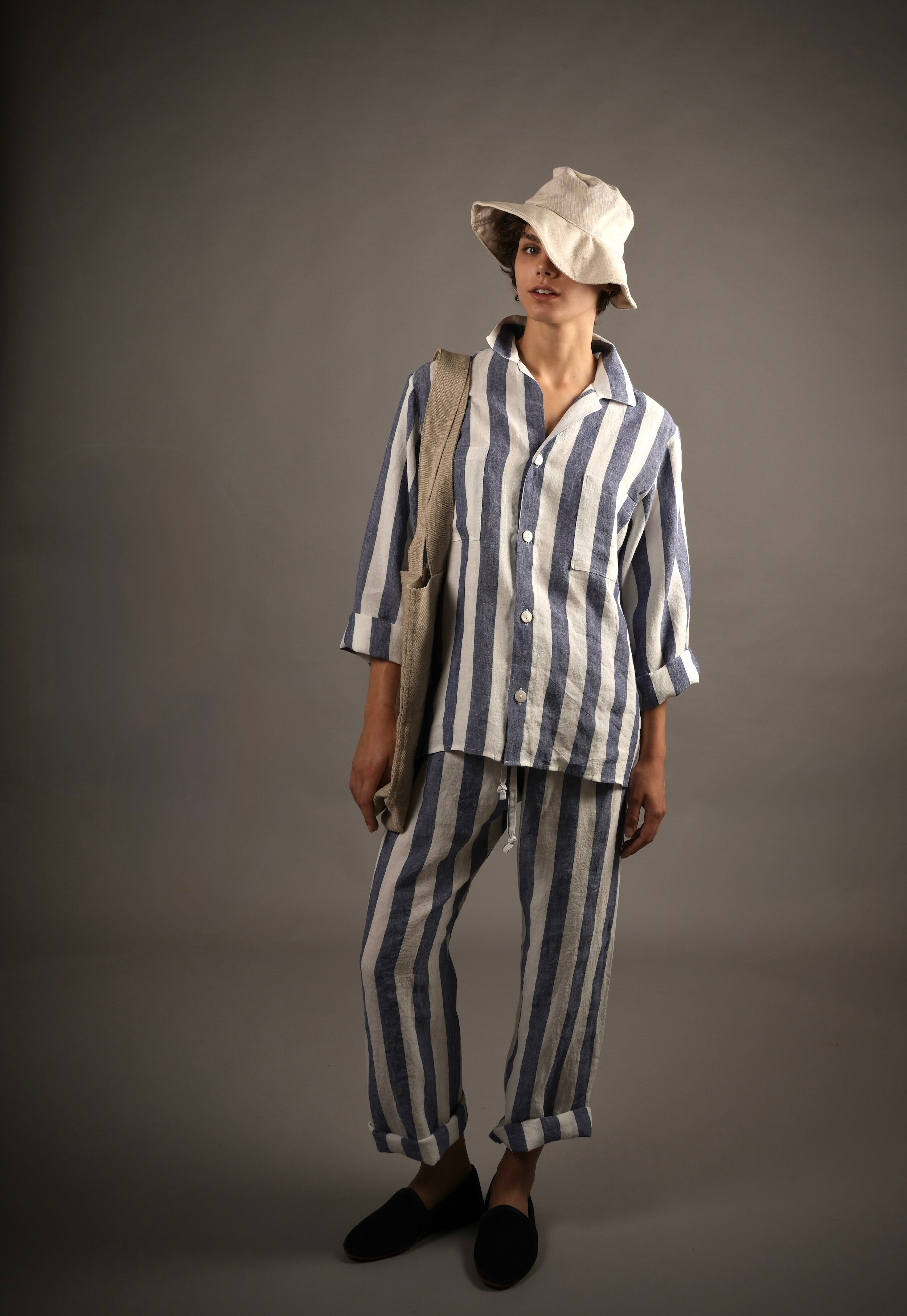 Els Wears Carrier Company Blue & White Striped Linen Pyjamas, Cotton sun Hat and Carries The Hemp hand Bag