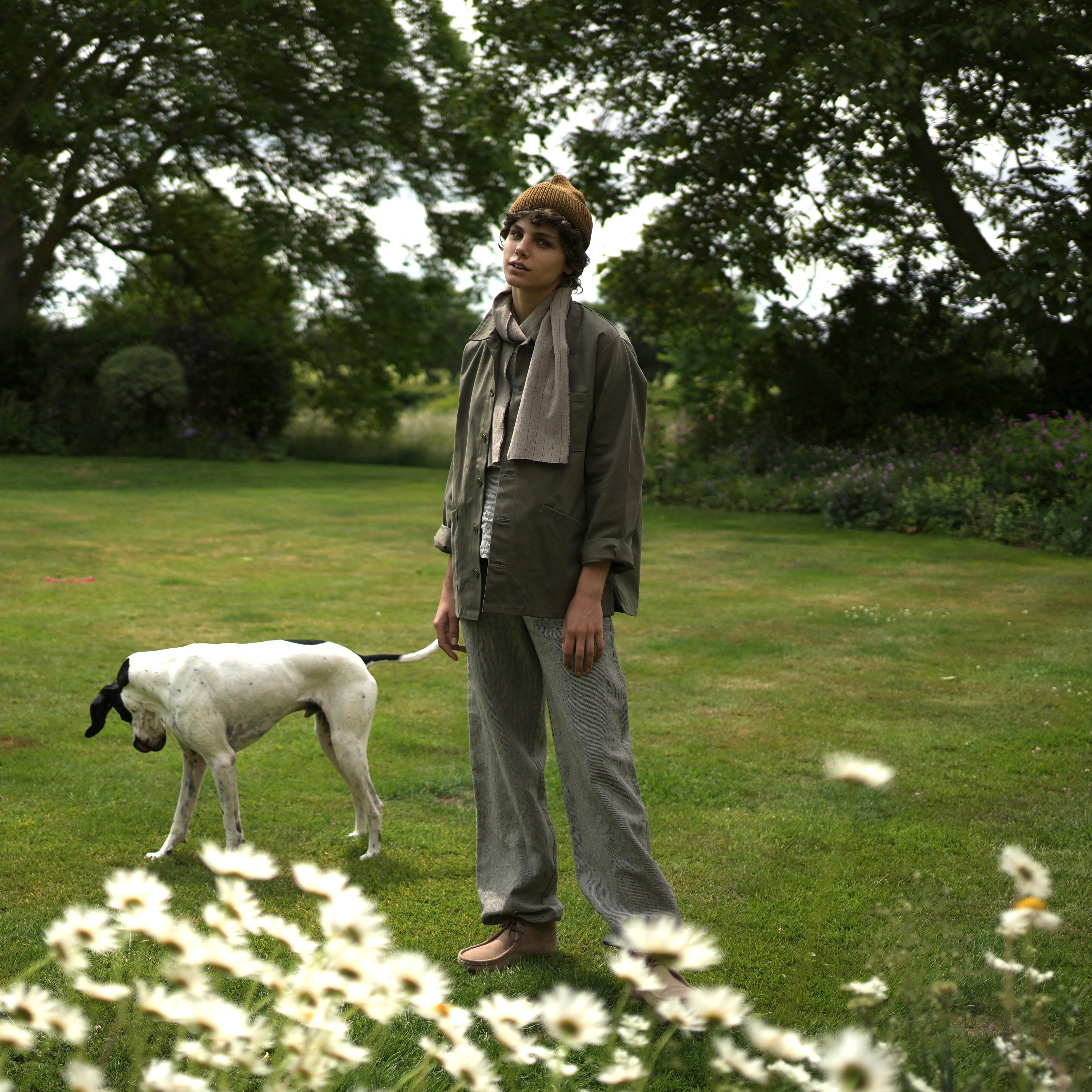Els wears Carrier Company Linen Jogger In Charcoal Needle Stripe Linen with Norfolk Work Jacket in Olive