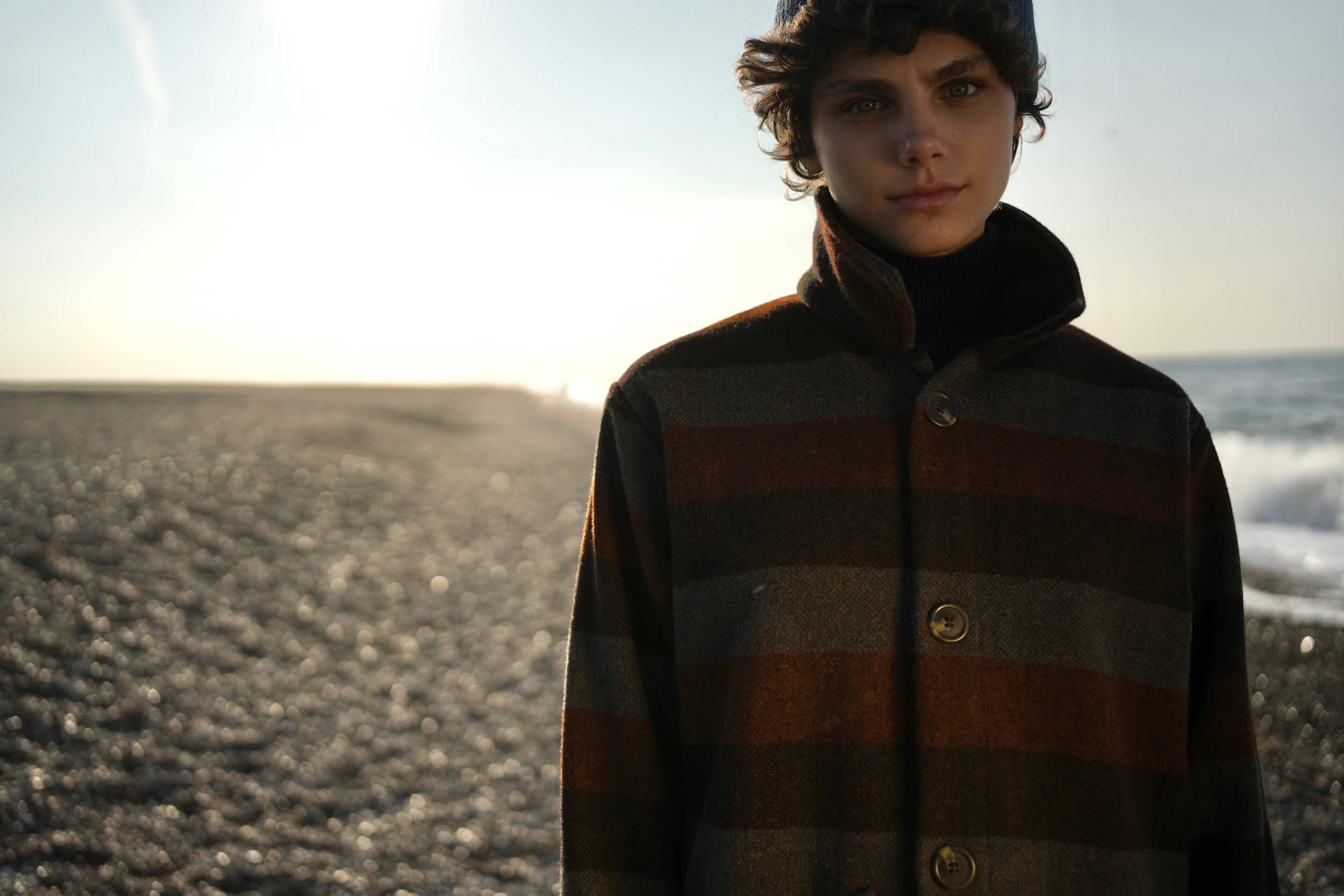 Els Wears Carrier Company Wool jacket in Conker Stripe With Superfino Merino Jumper, Dutch Trouser in Corduroy & Merino Watch Cap