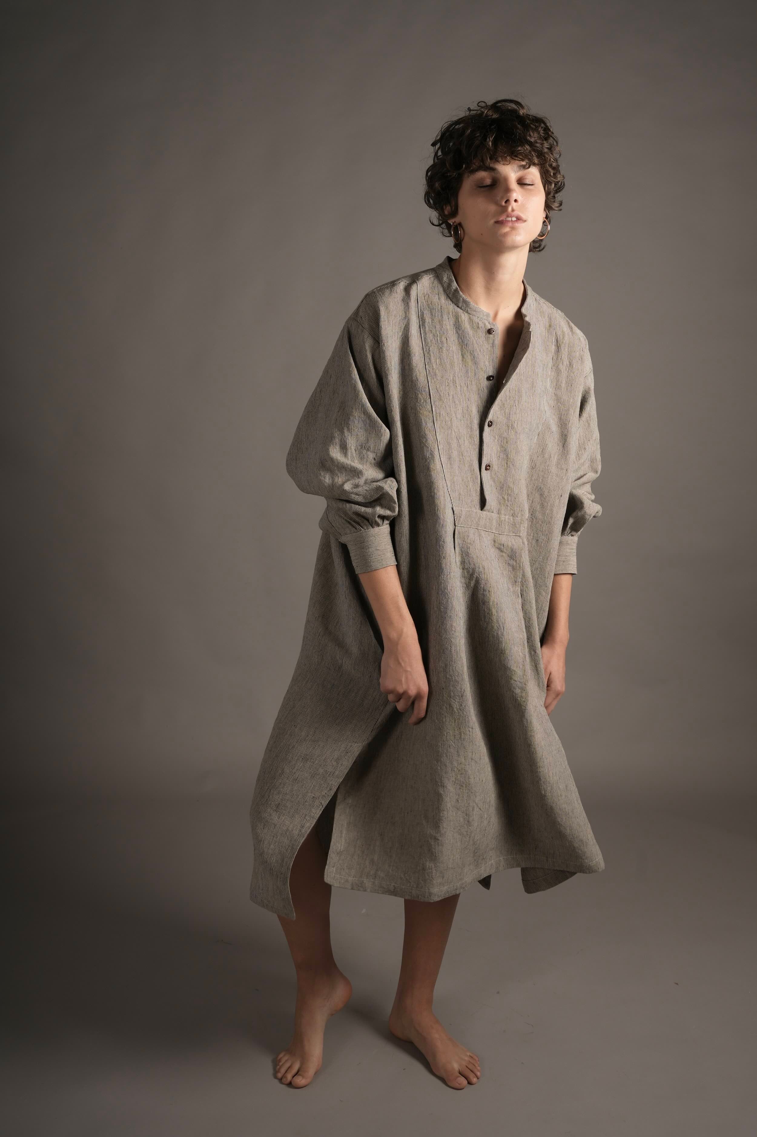 Els wears Carrier Company Léa Dress in Charcoal Needle Stripe linen.