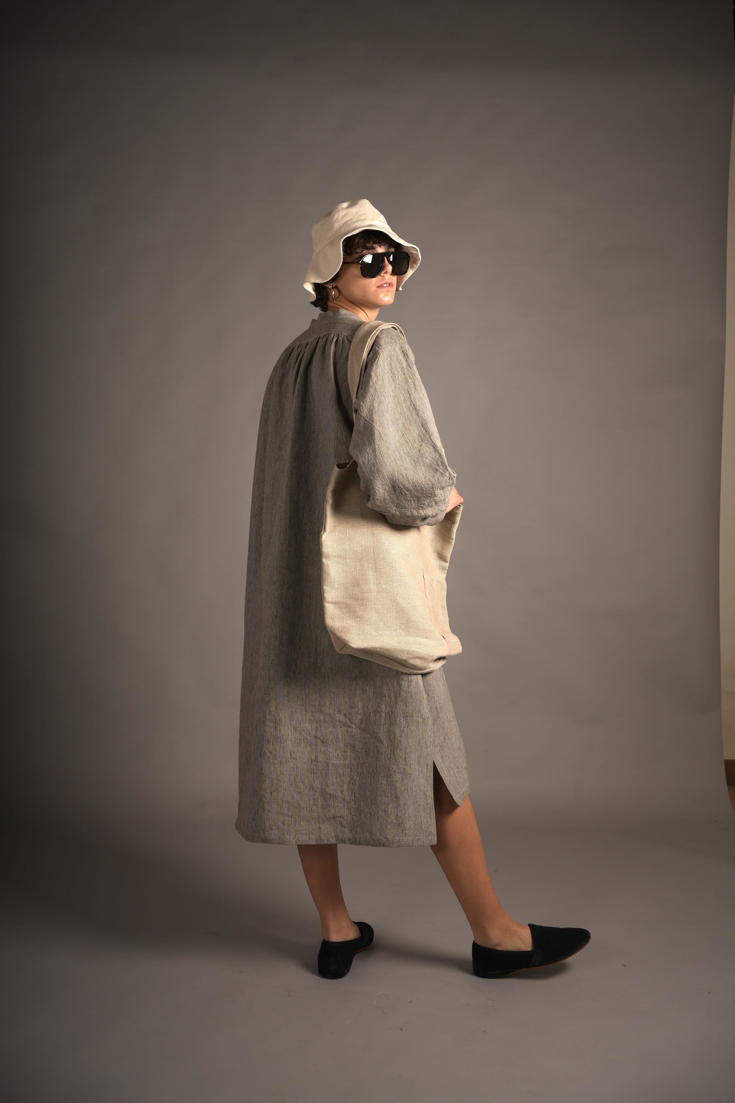 Els wears Carrier Company Léa Dress in Charcoal Needle Stripe linen & Cotton Sun Hat