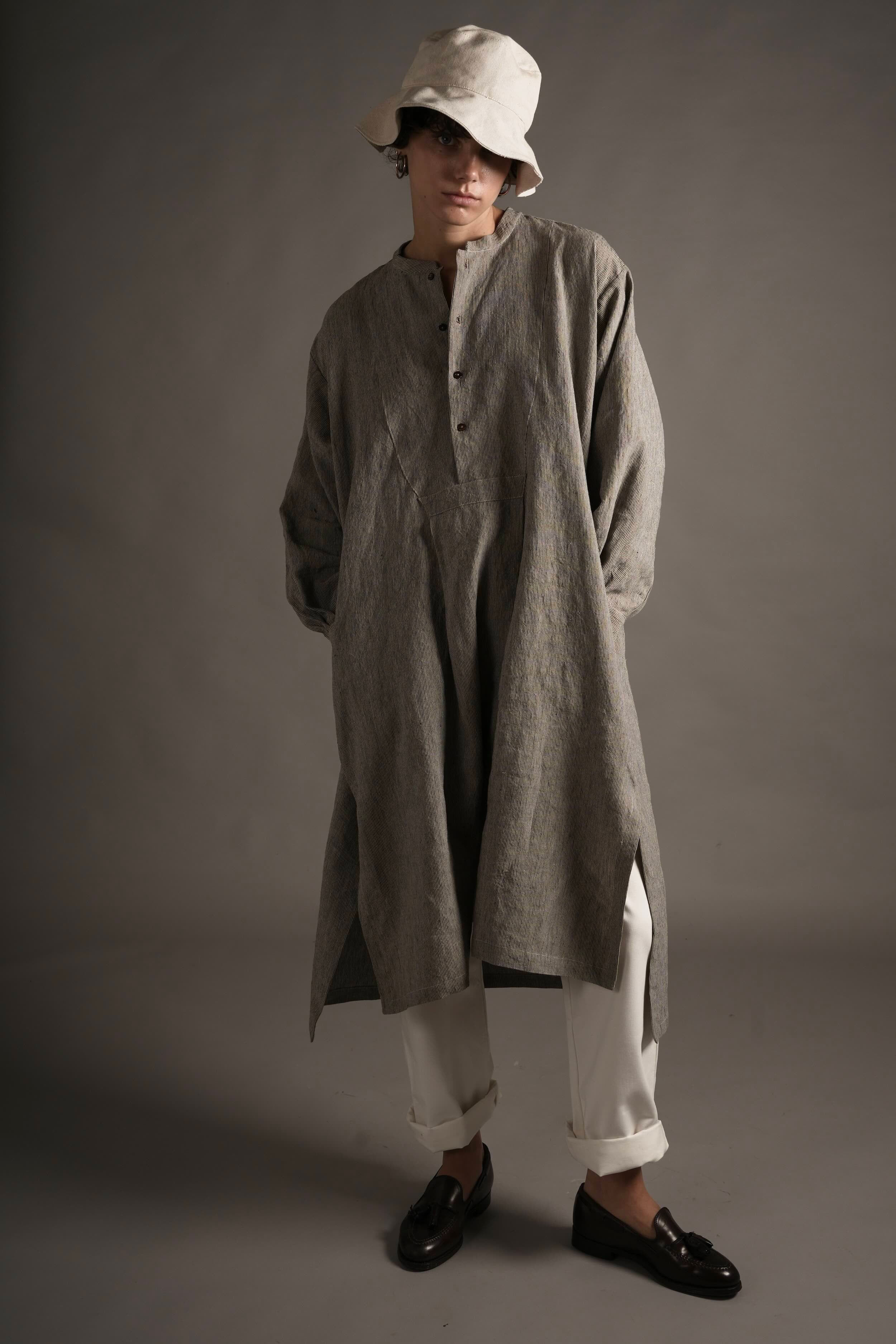 Els wears Carrier Company Léa Dress in Charcoal Needle Stripe linen, Women's Work Trouser in White & Cotton Sun Hat