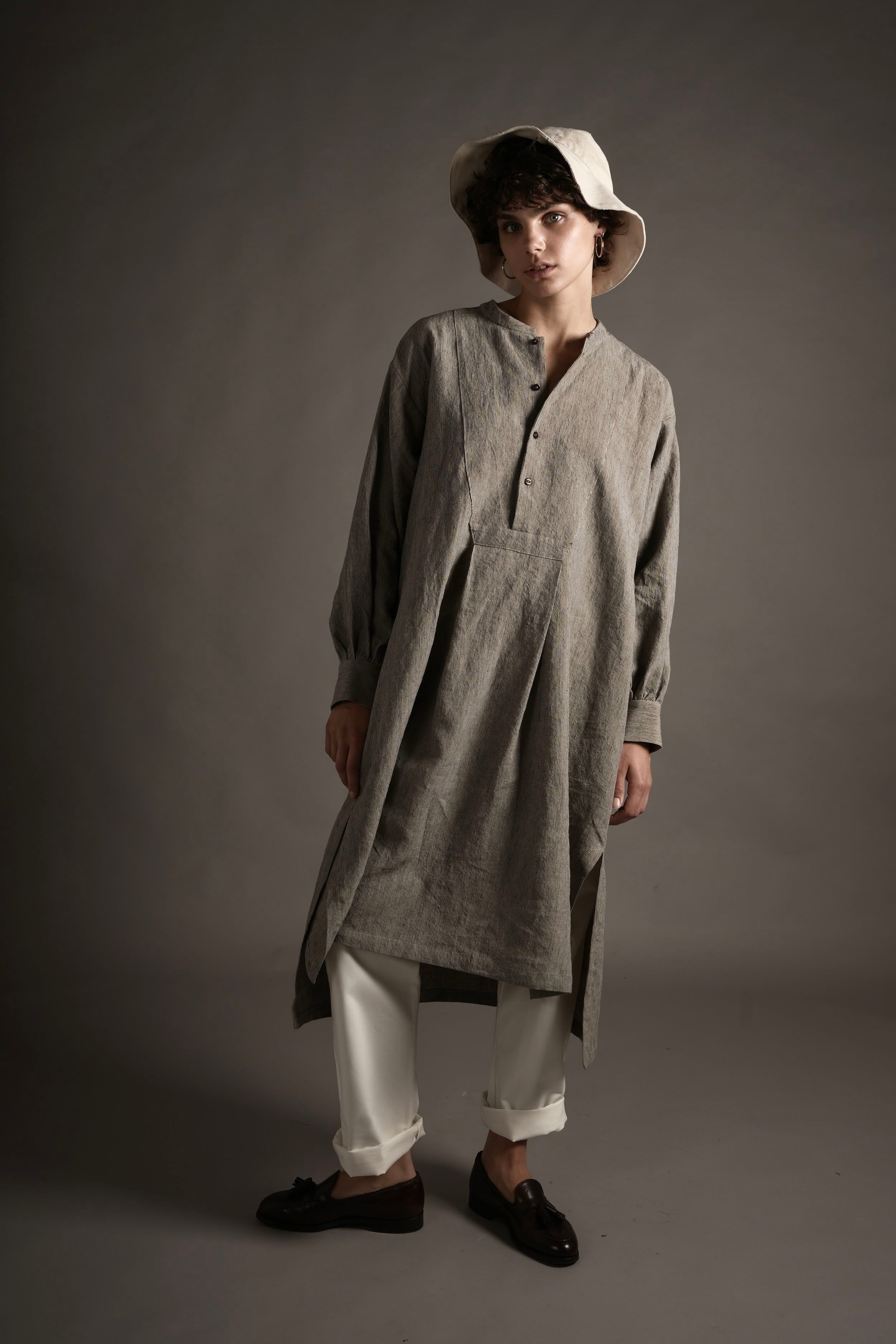 Els wears Carrier Company Léa Dress in Charcoal Needle Stripe linen, Women's Work Trouser in White @ Cotton Sun Hat