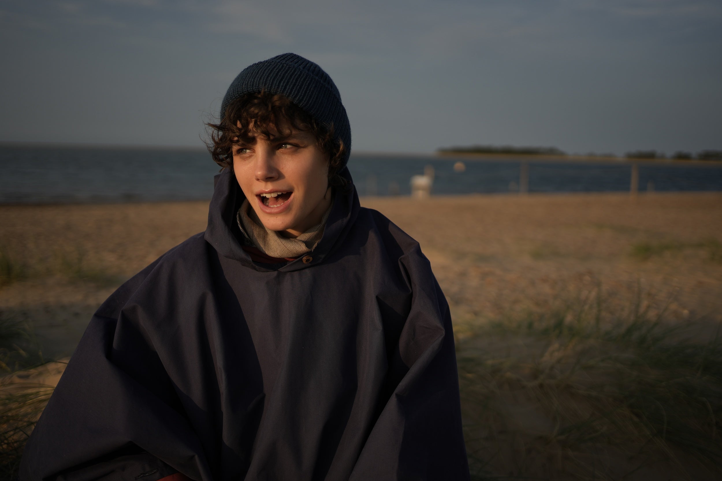 Els Wears Carrier Company navy blue hooded rain cape in navy blue.