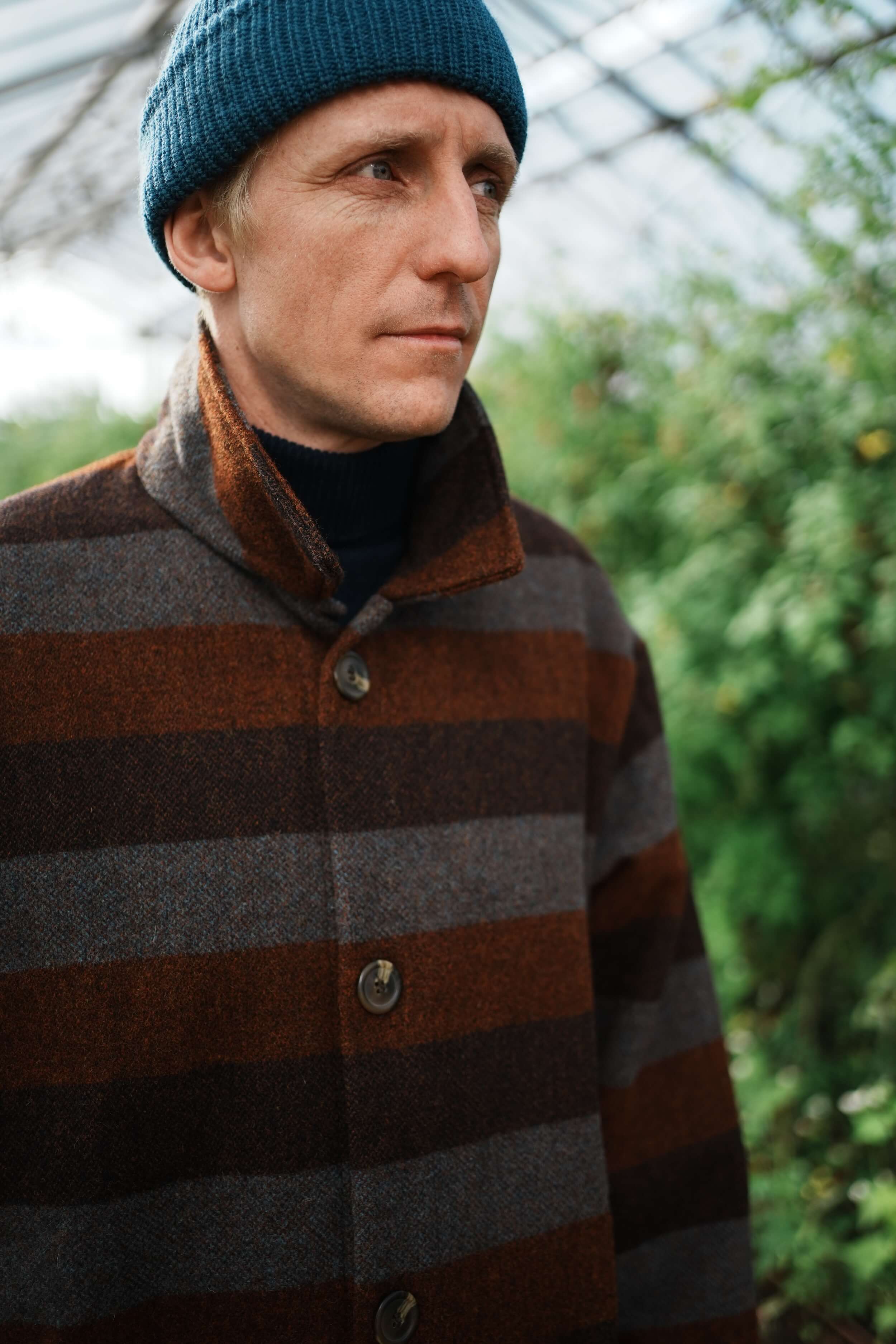 Tommy Wears Carrier Company Yorkshire Wool Jacket In Conker Stripe WIth Merino Wool Jumper, Wool Watch Cap & Men's Work Trouser in Tan
