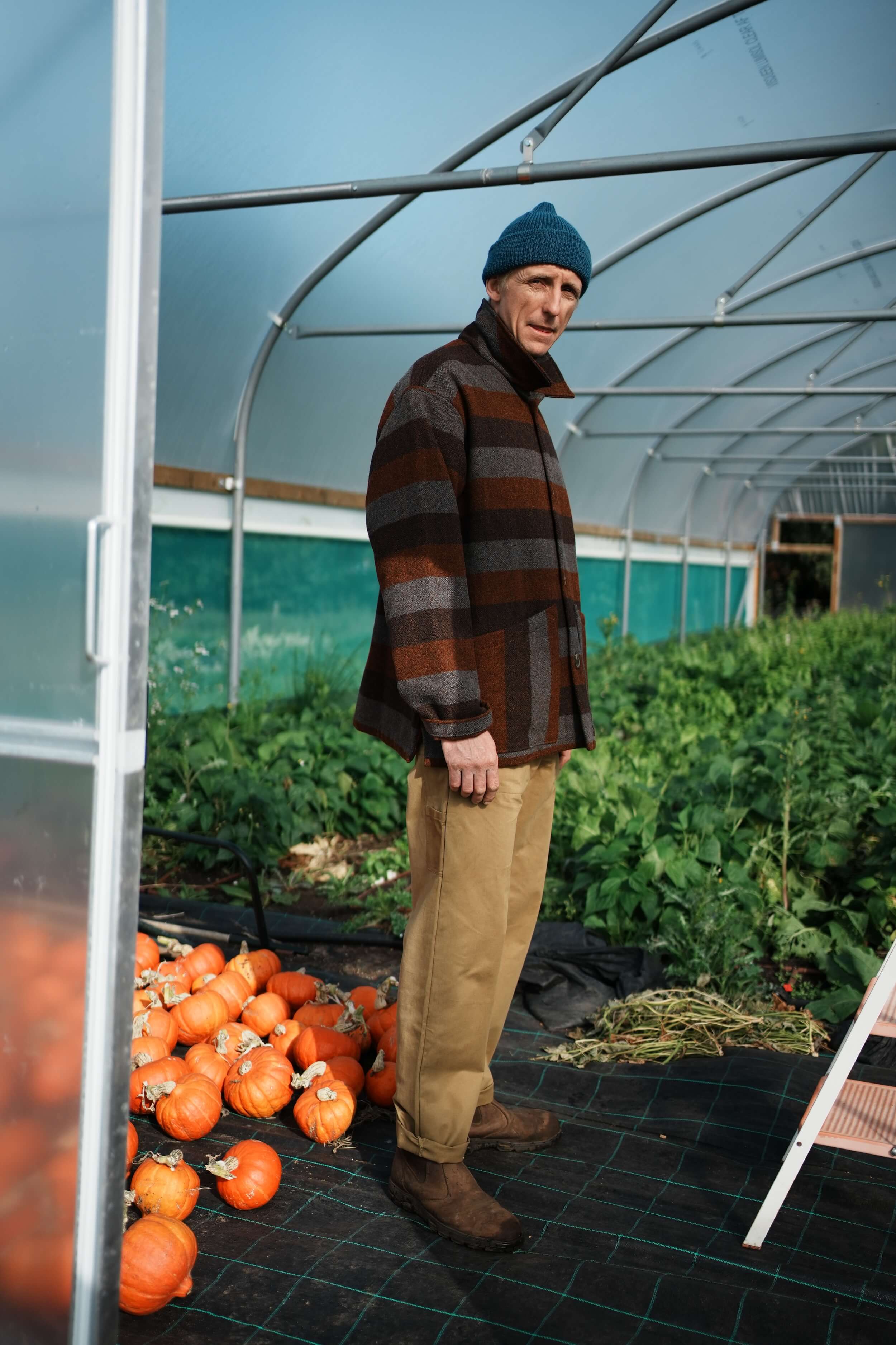 Tommy Wears Carrier Company Yorkshire Wool Jacket In Conker Stripe WIth Merino Wool Jumper, Wool Watch Cap & Men's Work Trouser in Tan