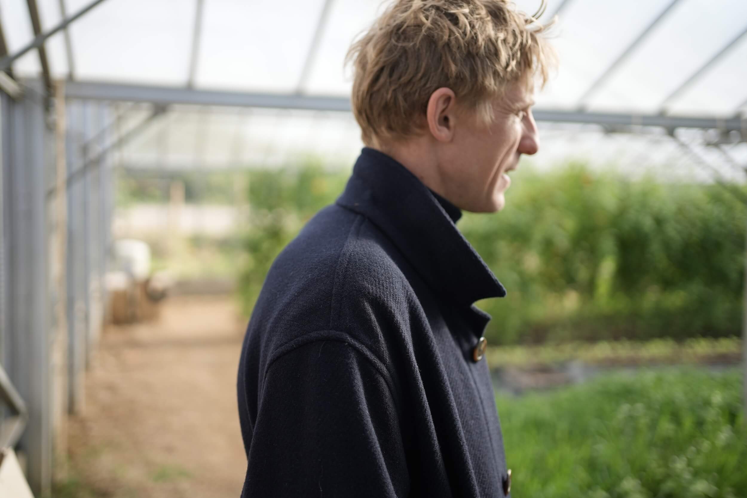 Tommy Wears Carrier Company Plain Wool Jacket in Navy, Supersoft Merino Rool Neck Jumper and Men's Work Trousers In Tan