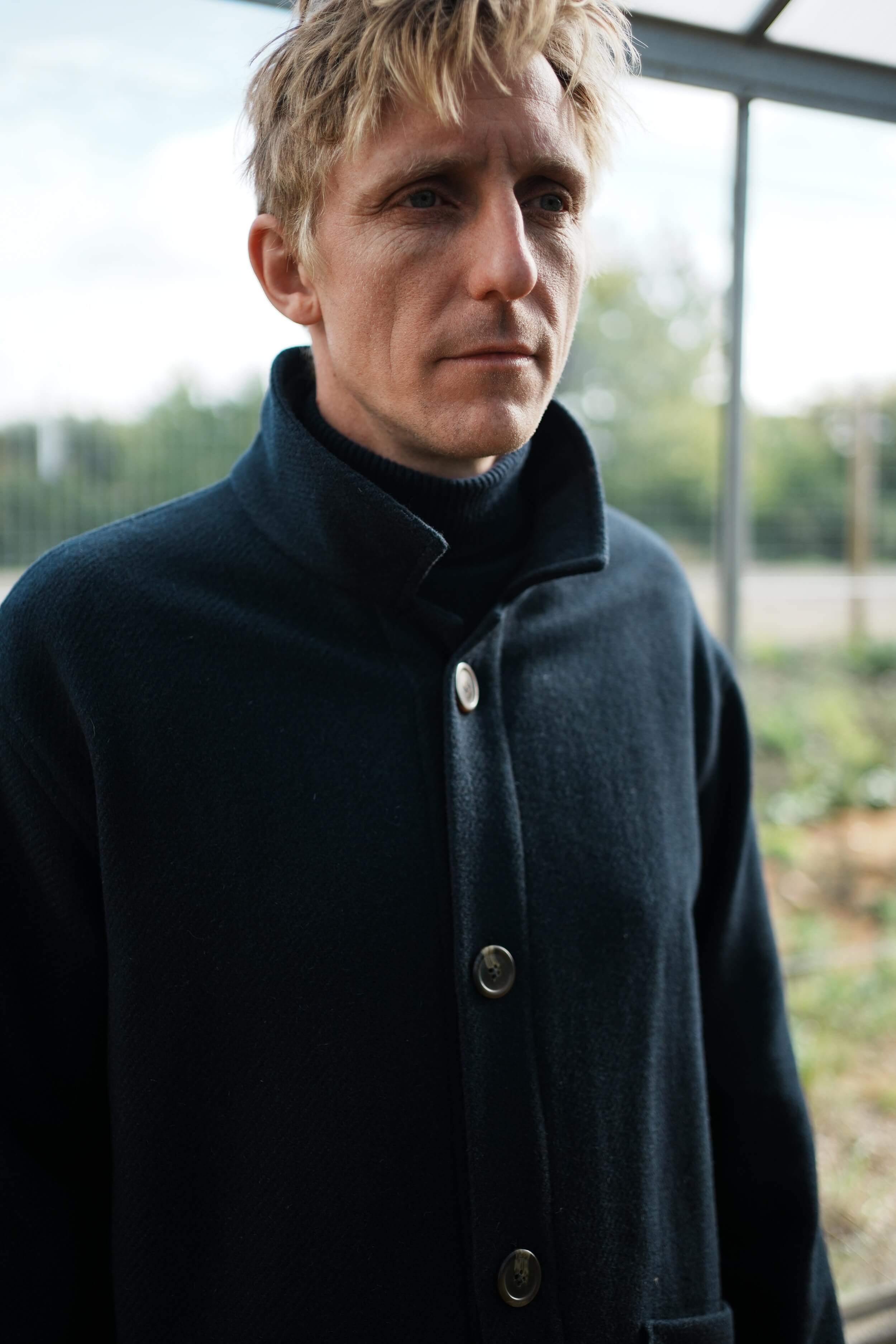 Tommy Wears Carrier Company Plain Wool Jacket in Navy, Supersoft Merino Rool Neck Jumper and Men's Work Trousers In Tan