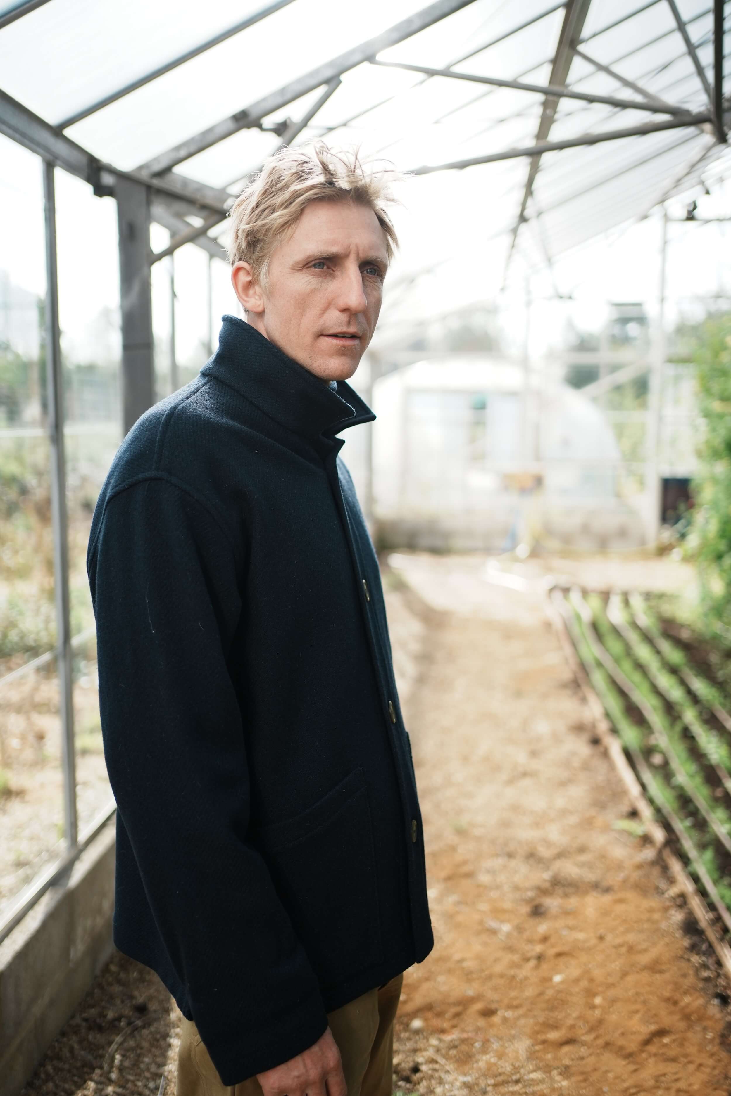 Tommy Wears Carrier Company Plain Wool Jacket in Navy, Supersoft Merino Rool Neck Jumper and Men's Work Trousers In Tan