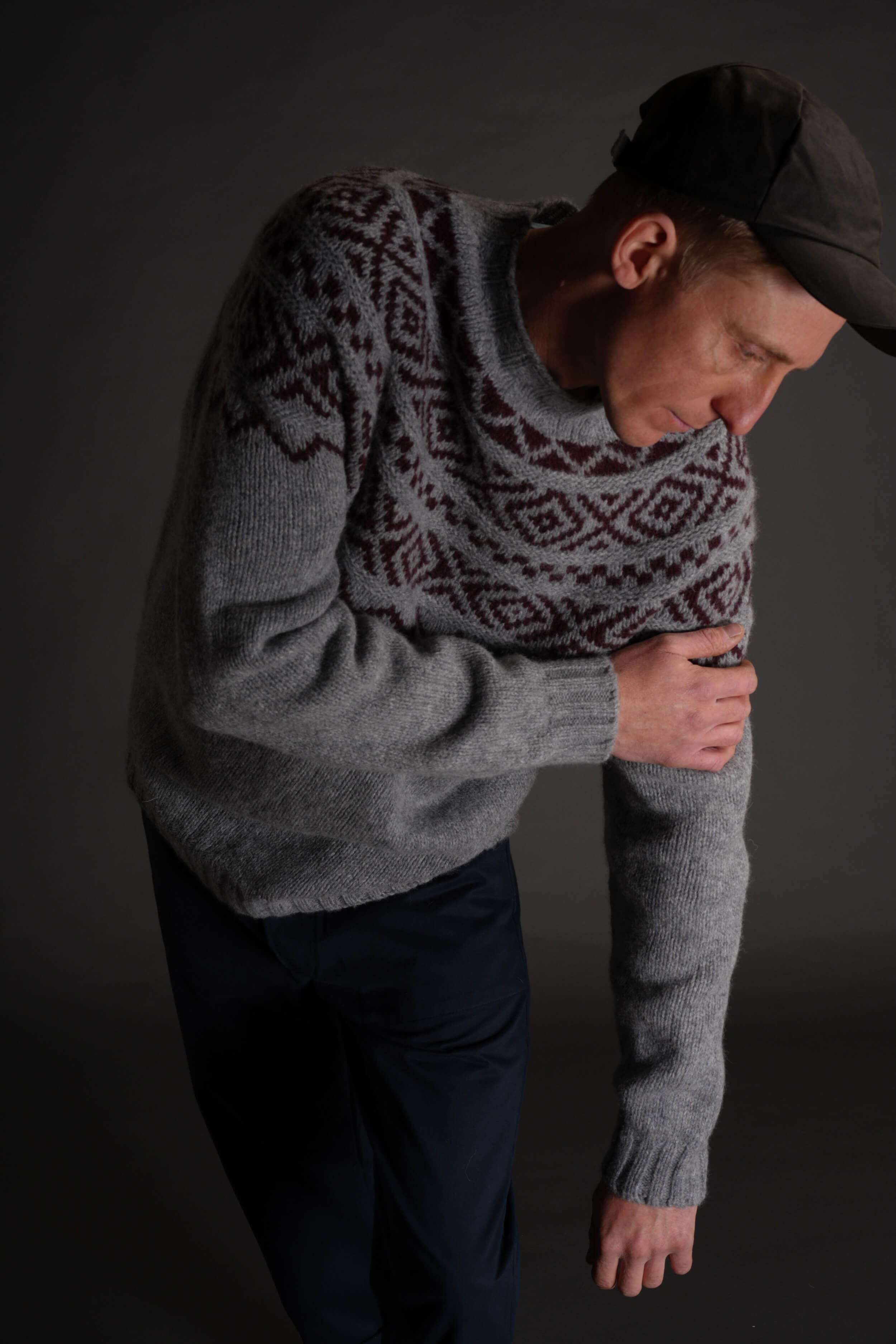 Tommy is 6'4" and wears an XL jumper