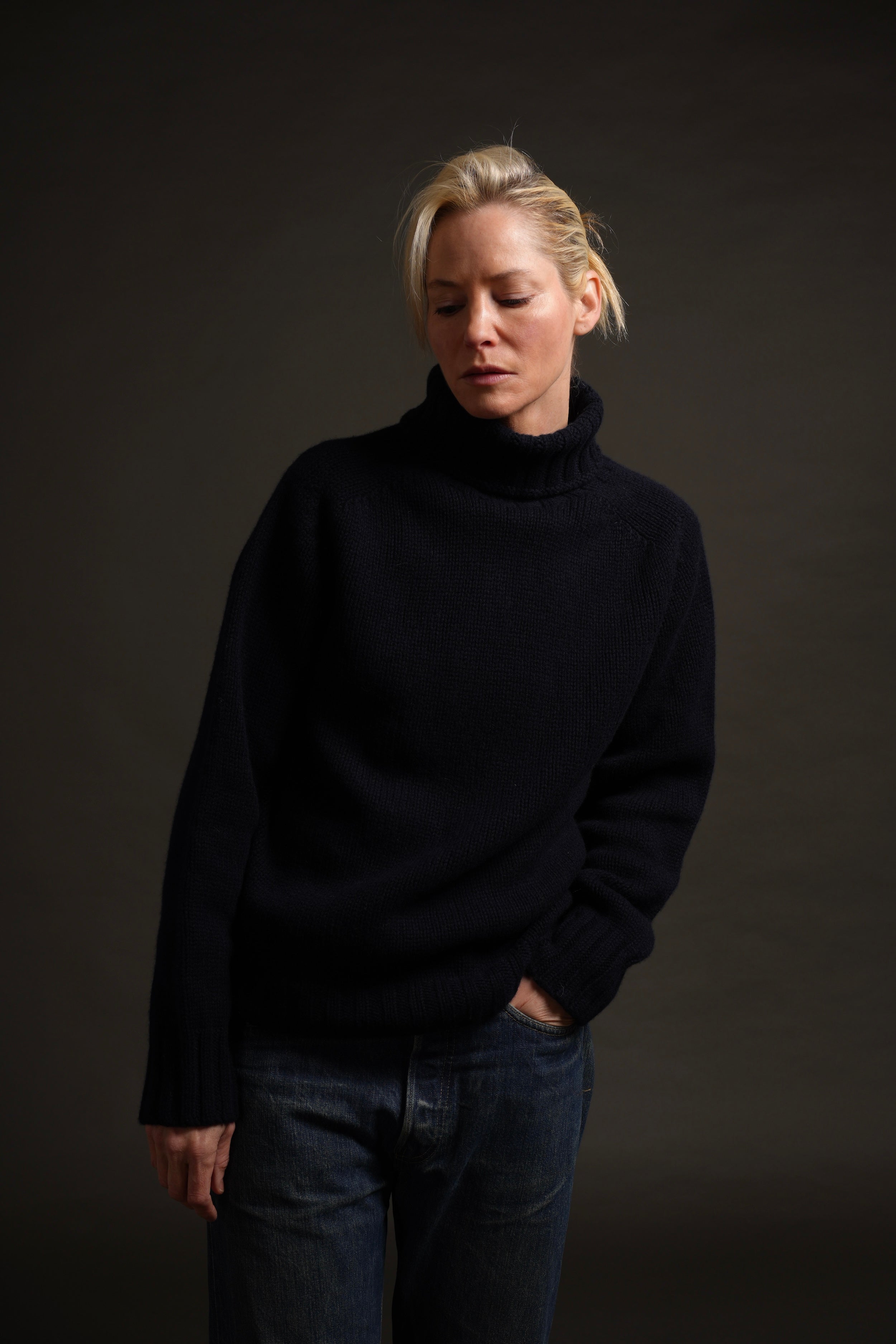 Sienna wears Navy Rollneck Supersoft Shetland jumper. Sienna is 5'6" and wears a size S