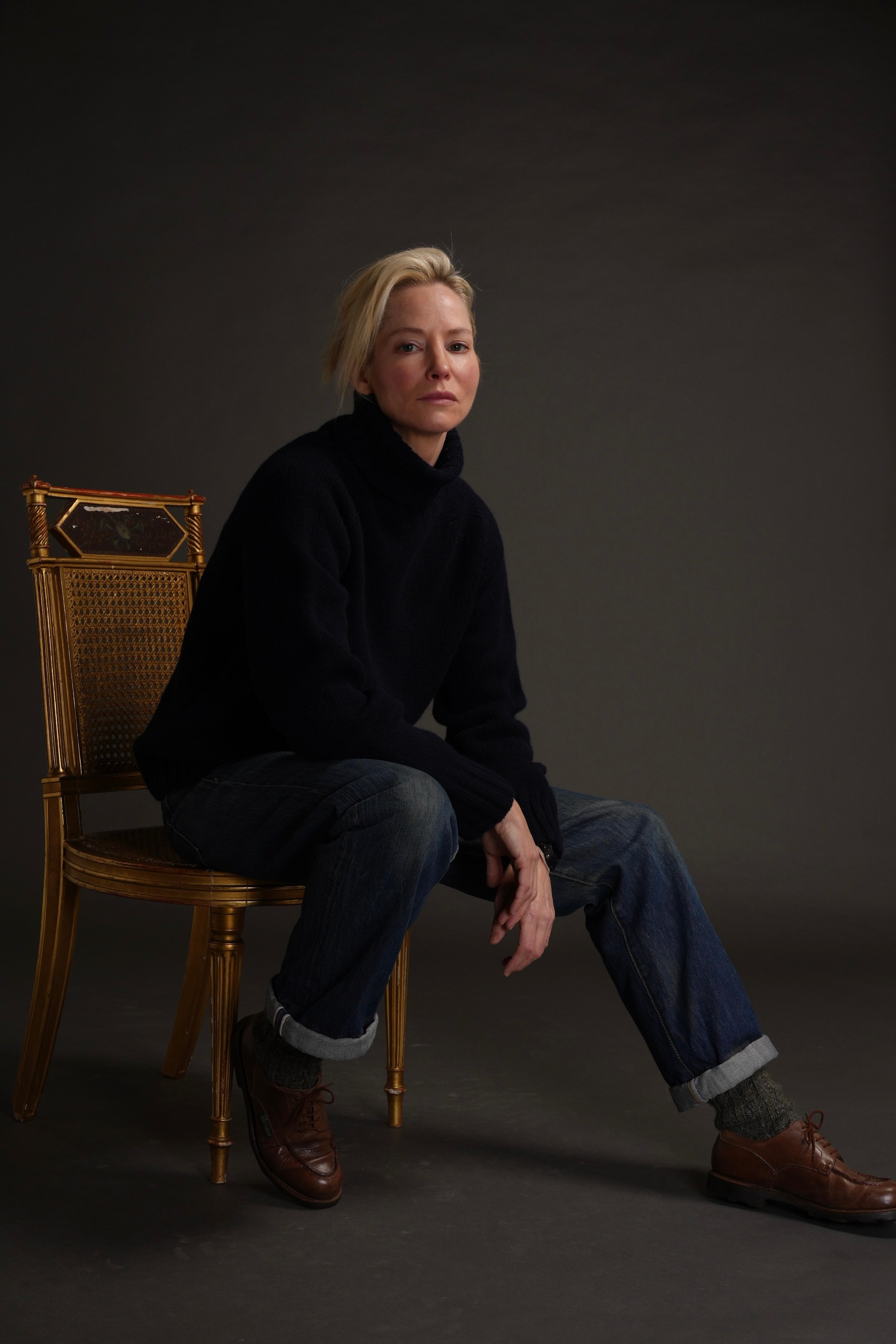 Sienna wears Navy Rollneck Supersoft Shetland jumper