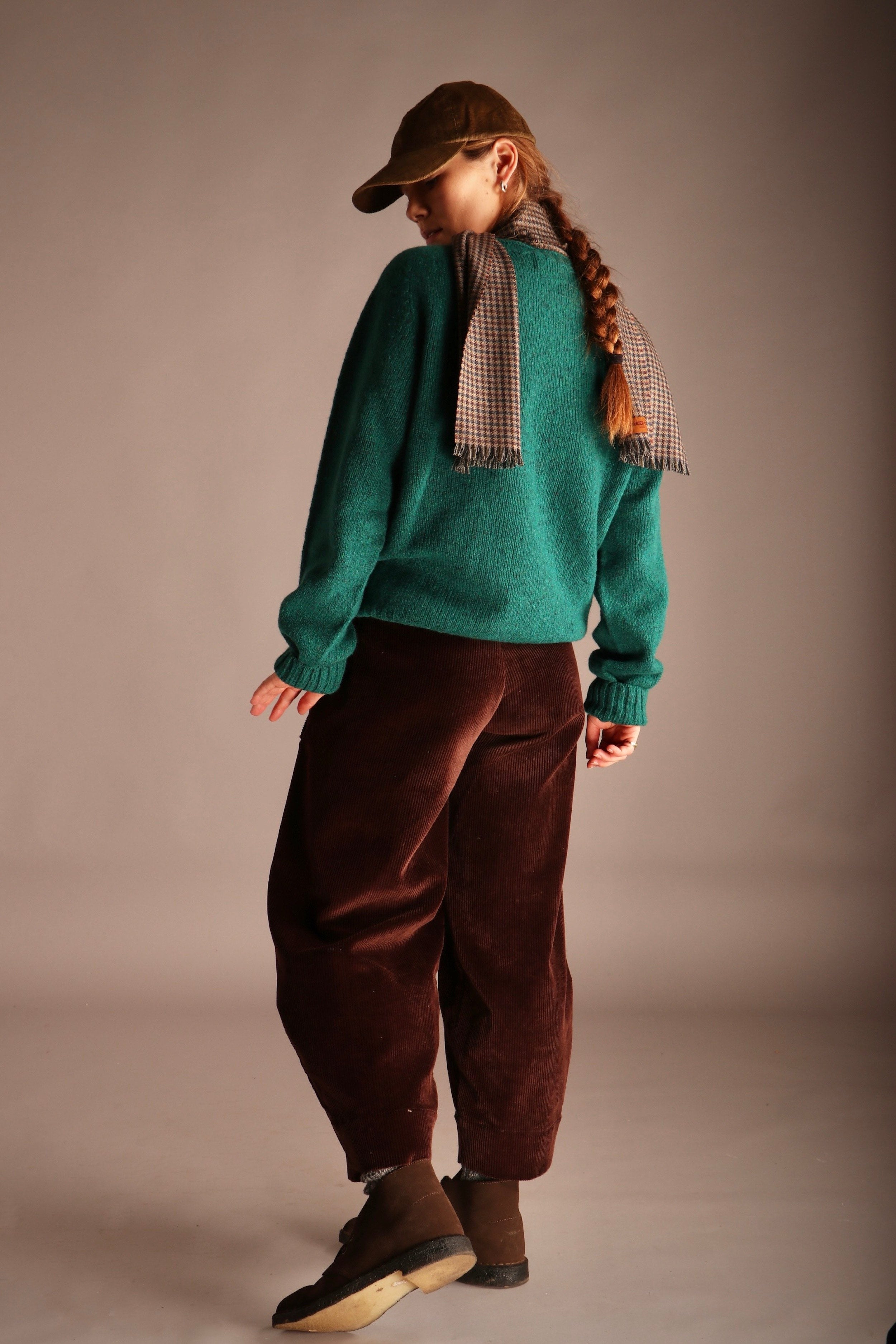 Decca wears Carrier Company Shetland Lambswool Jumper in Dragon with Dutch Trouser in Corduro, Corduroy Cap and Short Cashmere Scarf