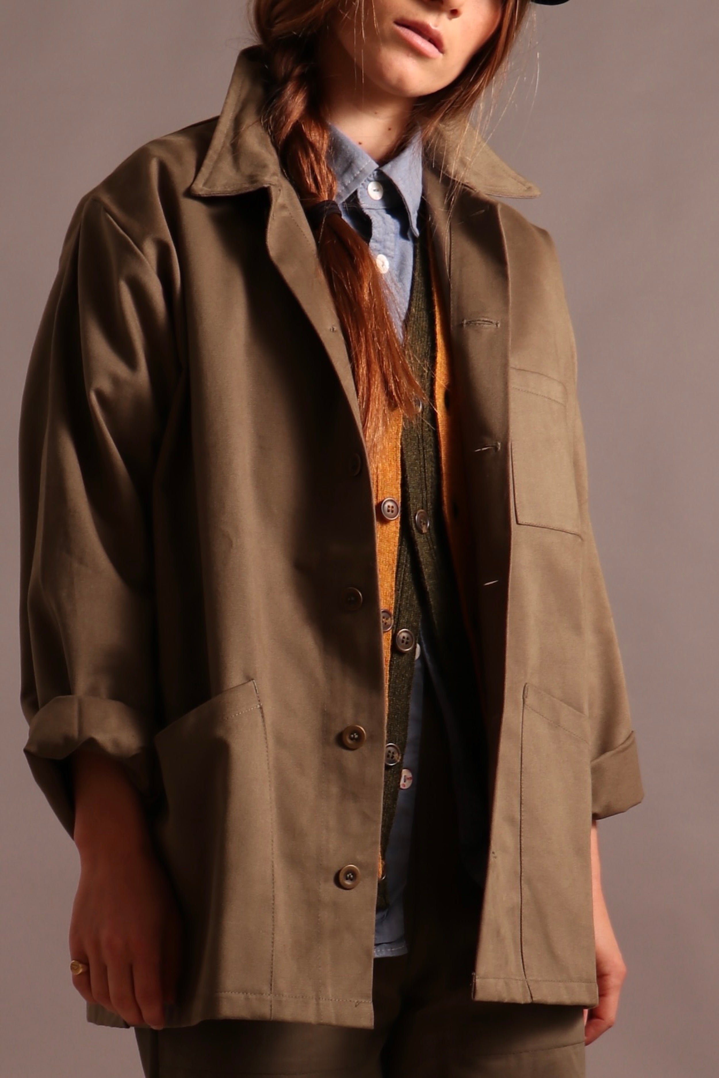 ecca wears Carrier Company Norfolk Work jacket with Sleeveless Cardigans, Pinpoint Chambray Shirt, Oilskin Cap and Women's Work Trouser