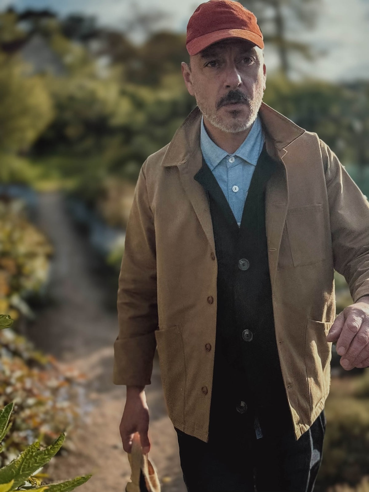 Enzo wears Carrier Company Norfolk Work Jacket in Tan with Men's Work rousers and Corduroy Cap