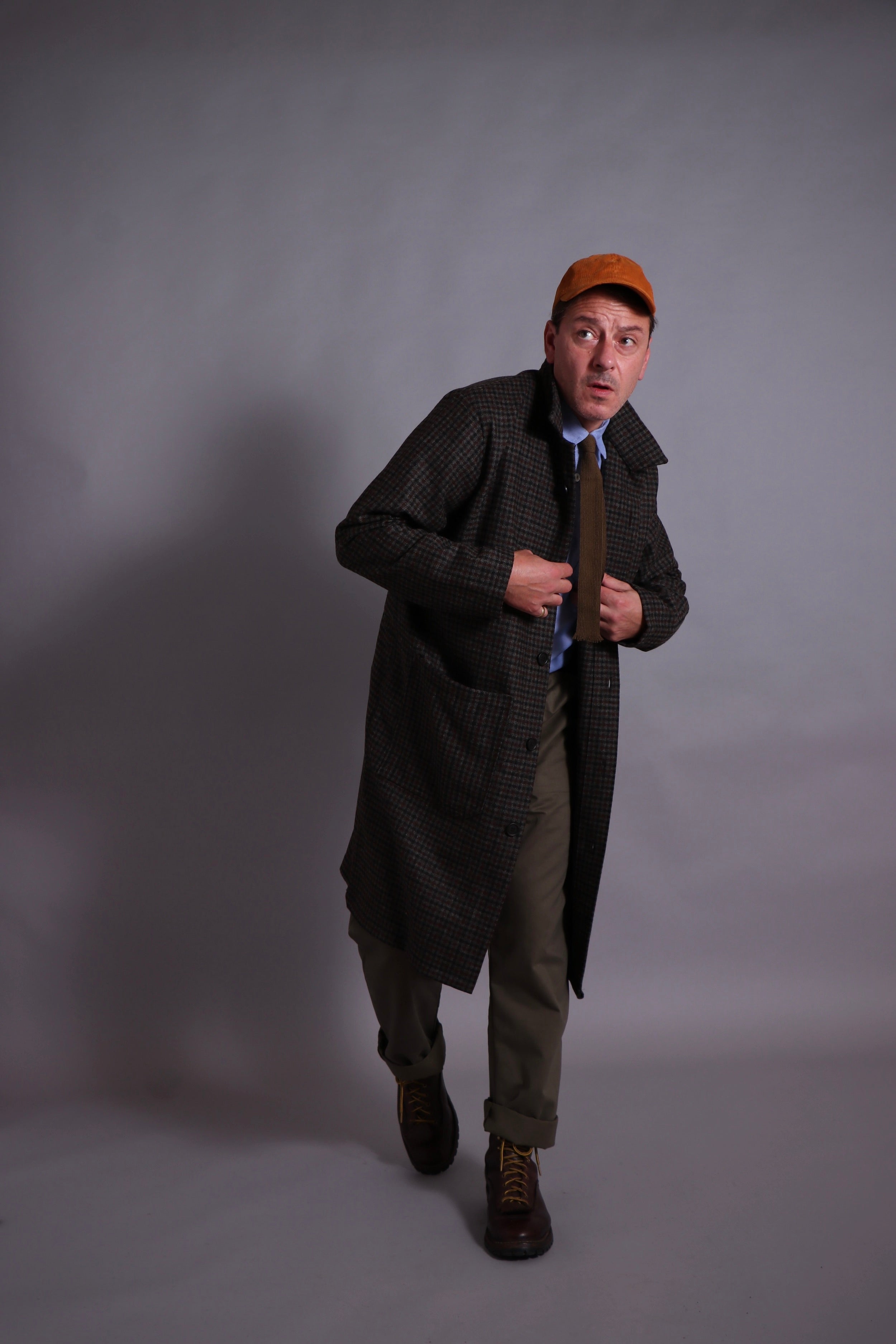 Enzo wears Carrier Company Wool Coat, with Chambray Poplin Shirt and Olive Work Trousers