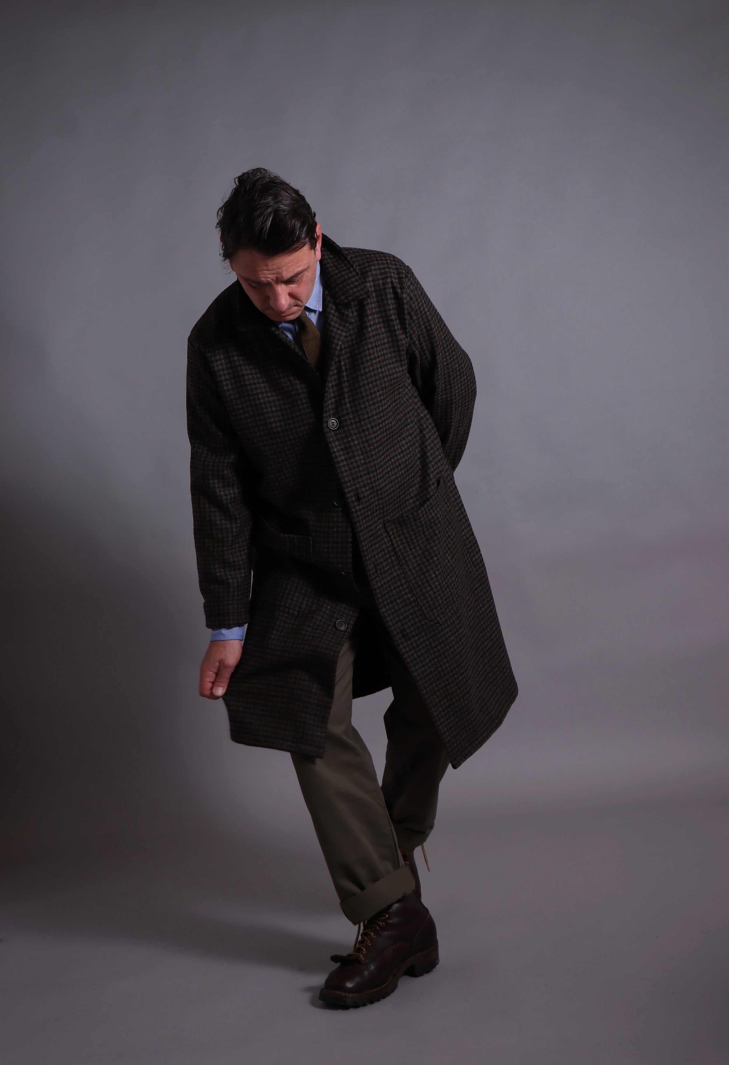 Enzo wears Carrier Company Wool Coat, with Chambray Poplin Shirt and Olive Work Trousers