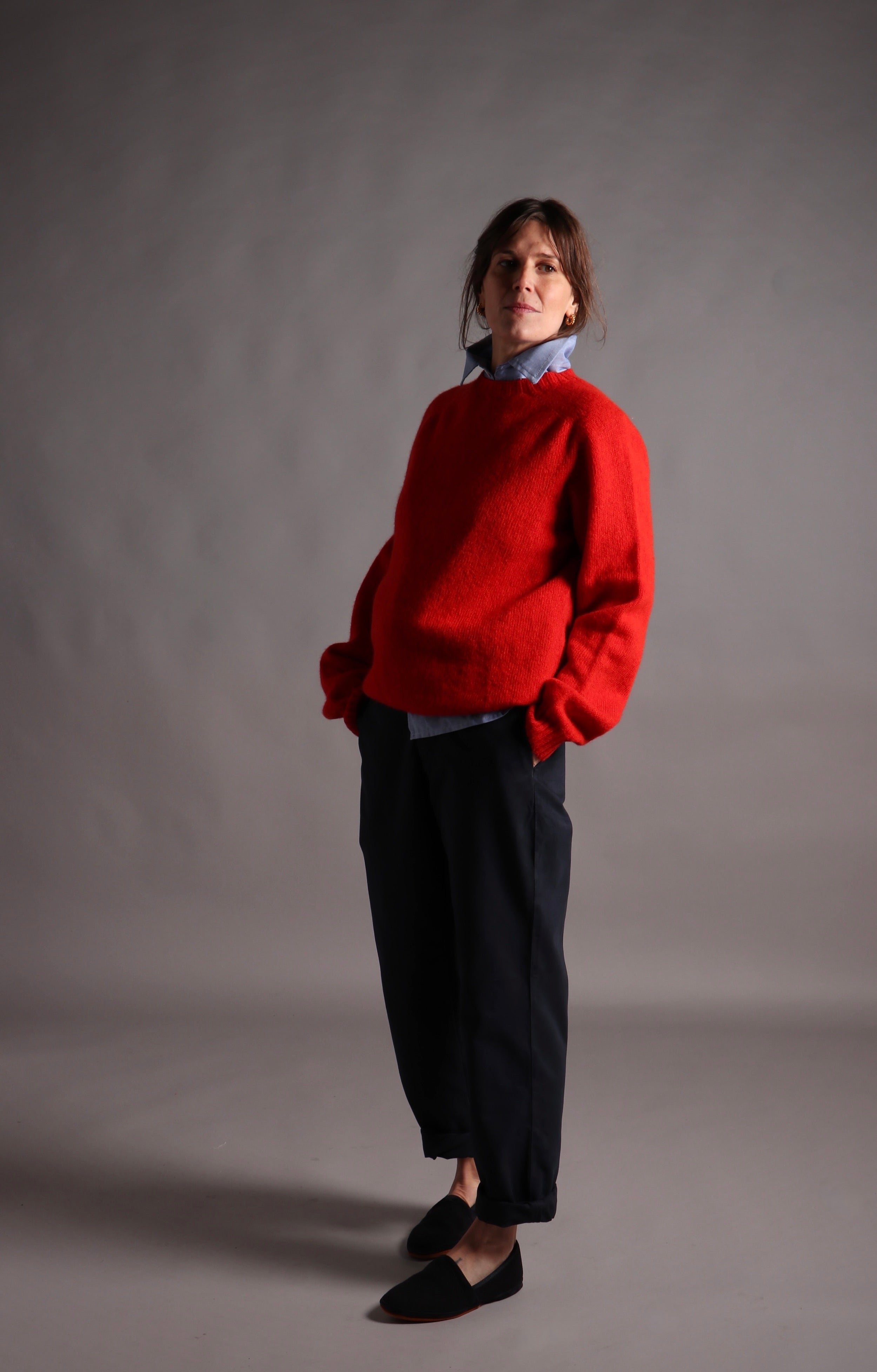Kate wears Carrier Company Shetland Lambswool Jumper in Scarlett with High Waist trouser in Navy Drill