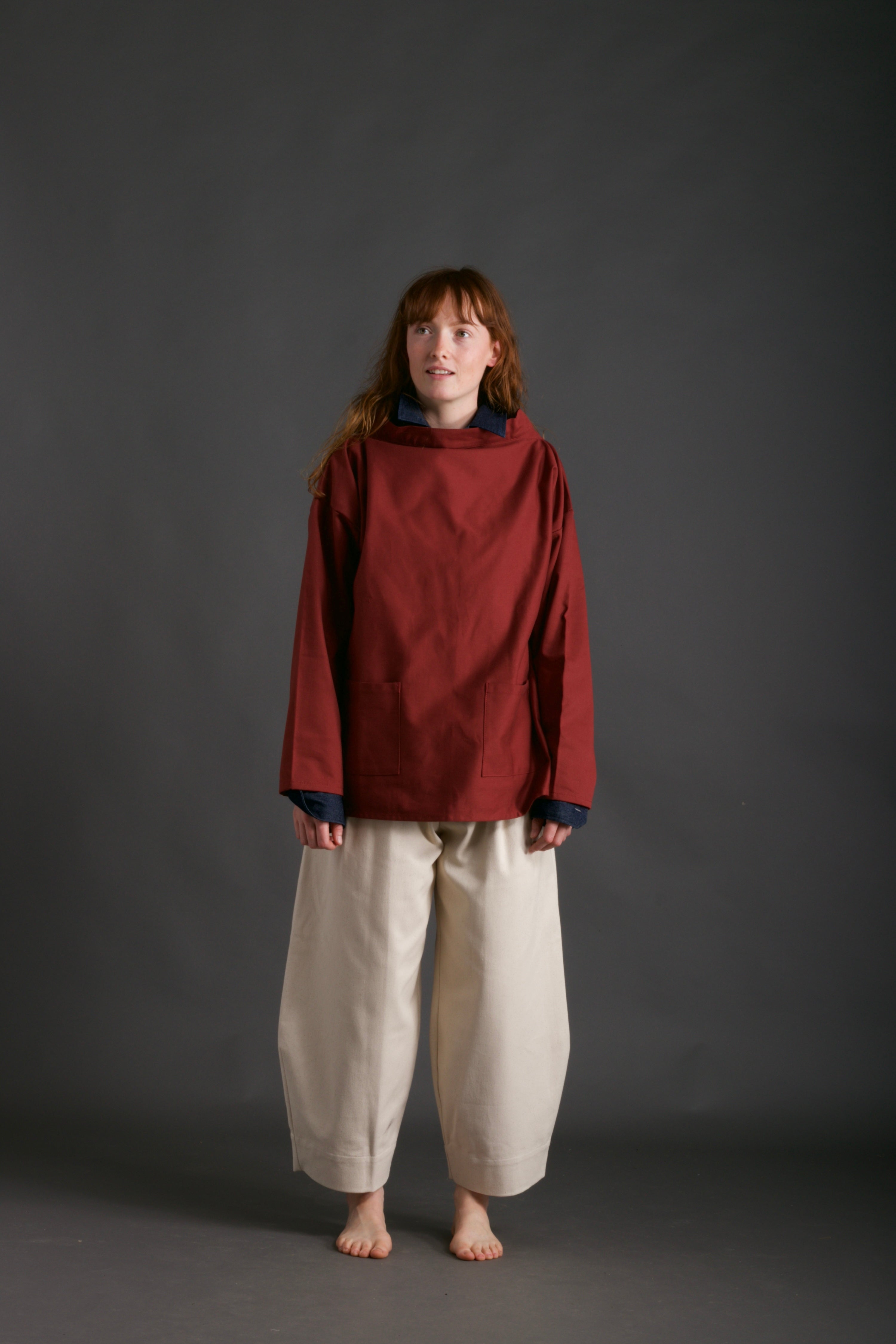 Woman wearsCarrier Company Traditional Norfolk Slop in Breton Red with Dutch Trouser in Seeded Denim