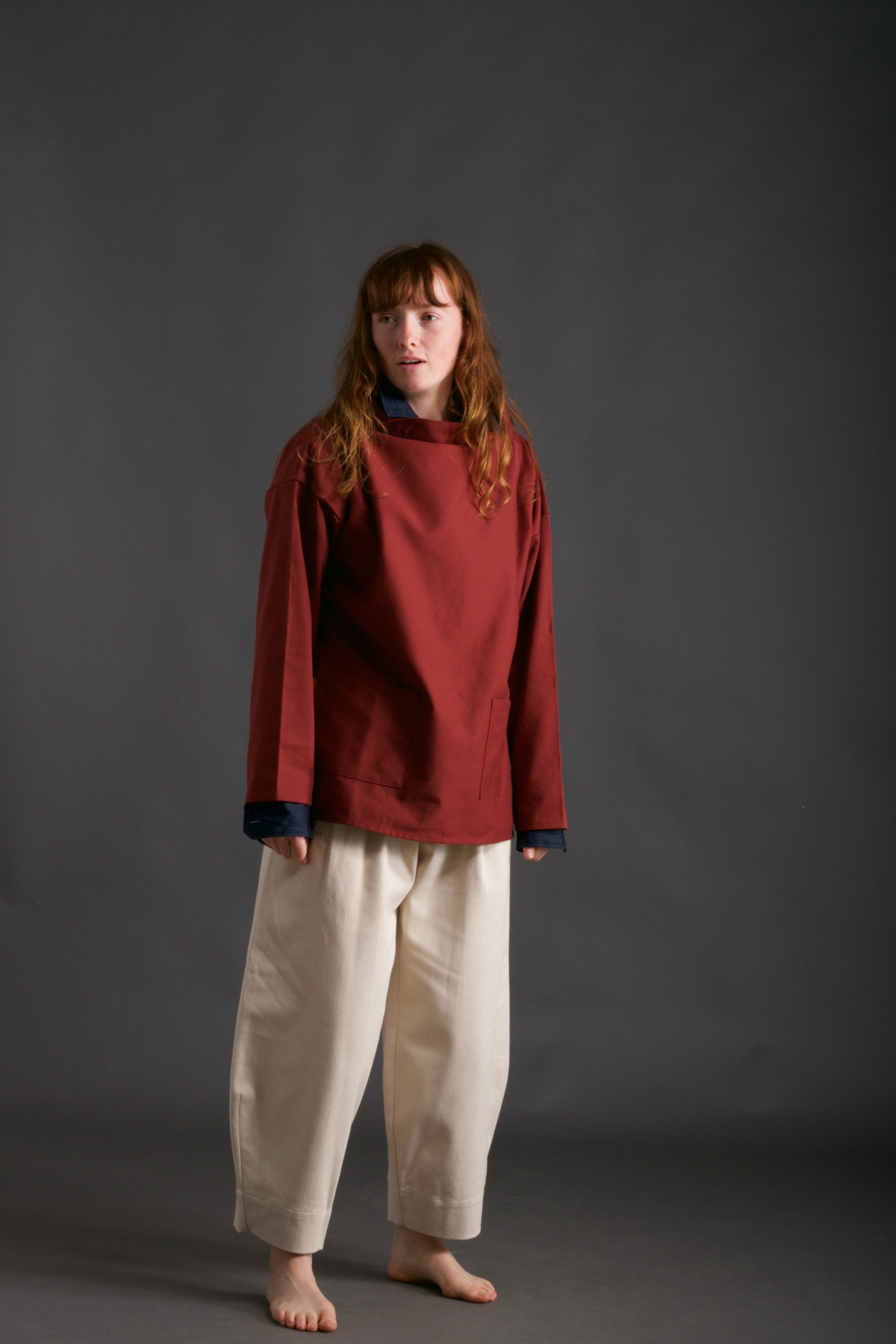 Woman wearsCarrier Company Traditional Norfolk Slop in Breton Red with Dutch Trouser in Seeded Denim