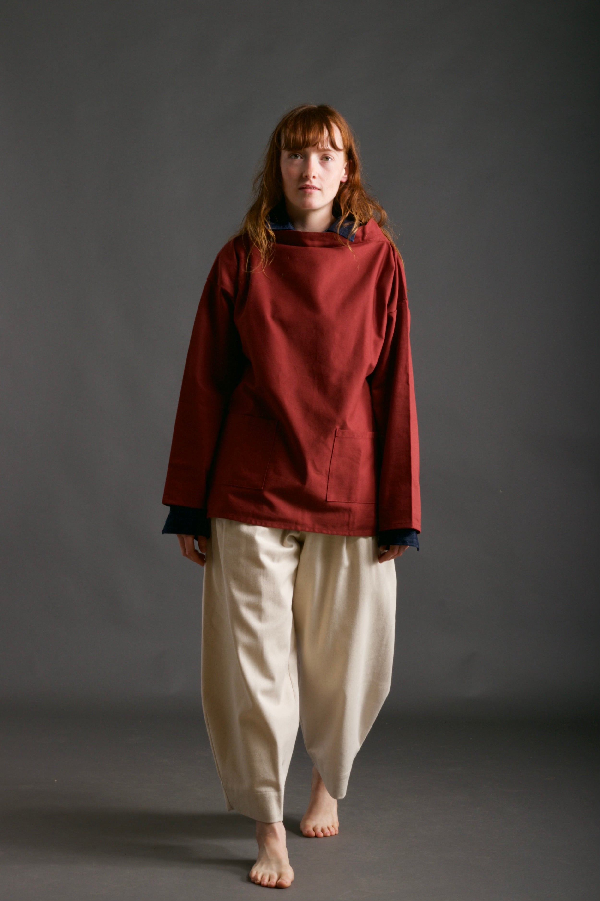 Woman wearsCarrier Company Traditional Norfolk Slop in Breton Red with Dutch Trouser in Seeded Denim