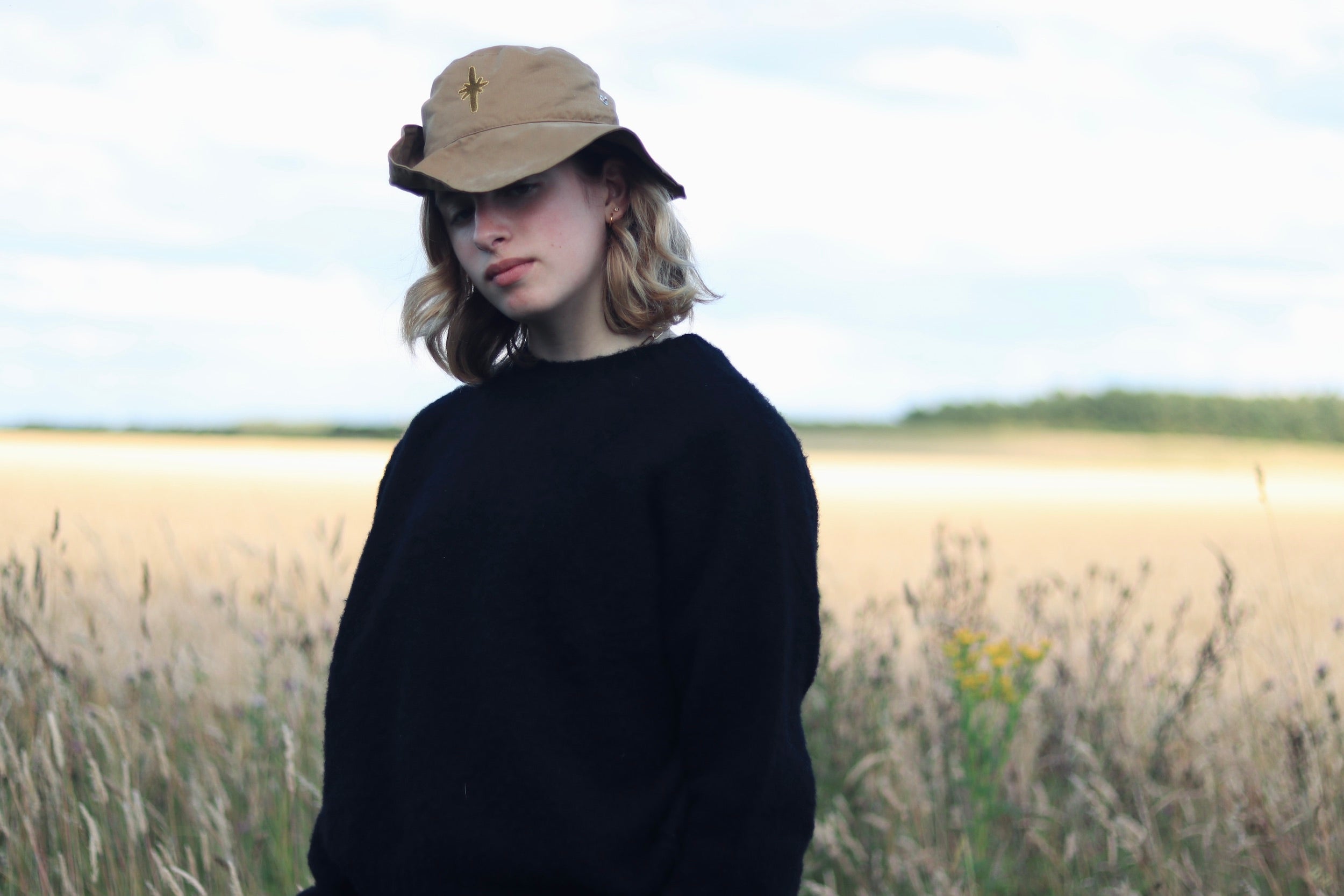 Lucia wears Carrier Company Shetland Brushed Wool cropped jumper in Black