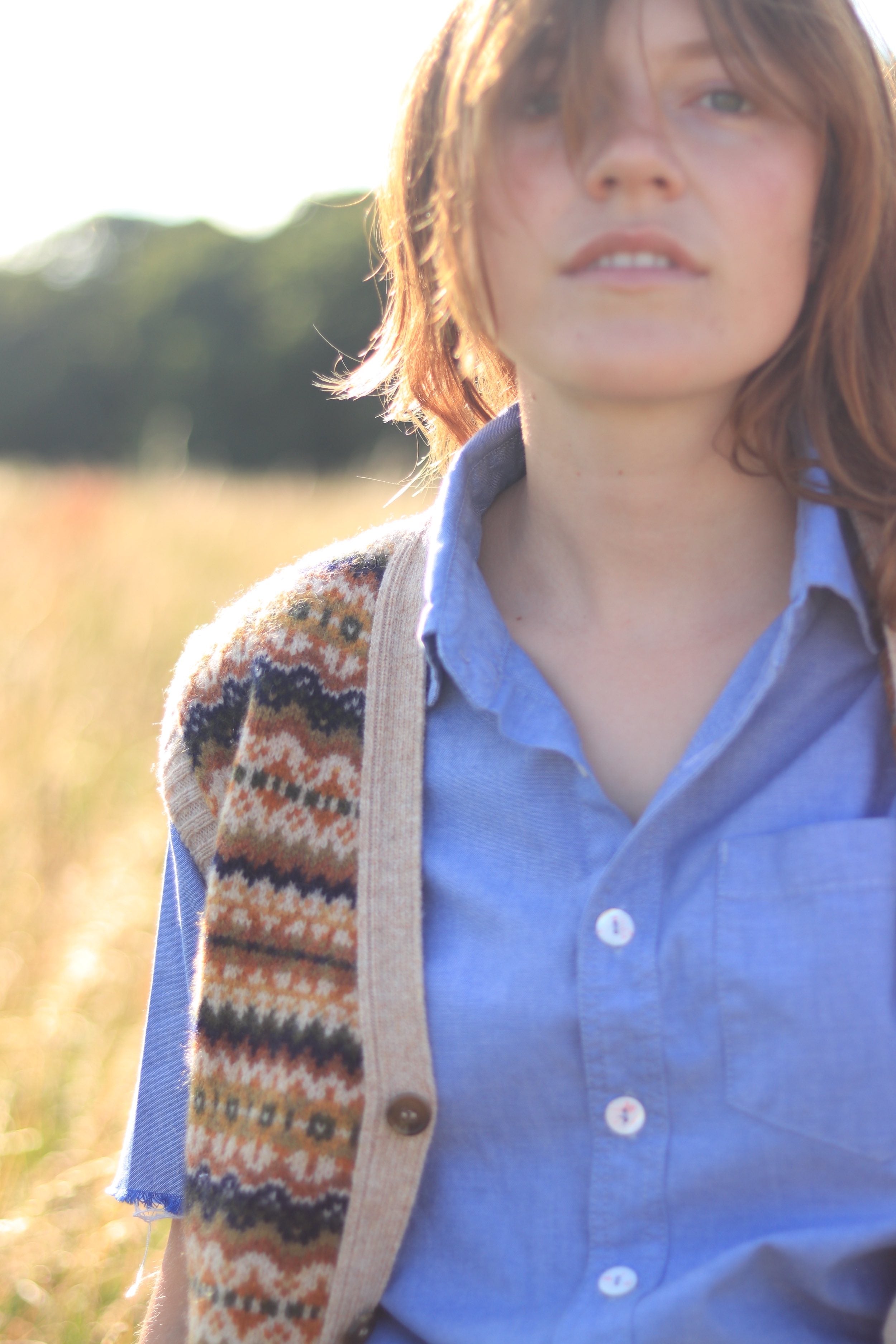 Minna wears Carrier Company Sleeveless Fair Isle Cardigan with Pinpoint Chambray Shirt