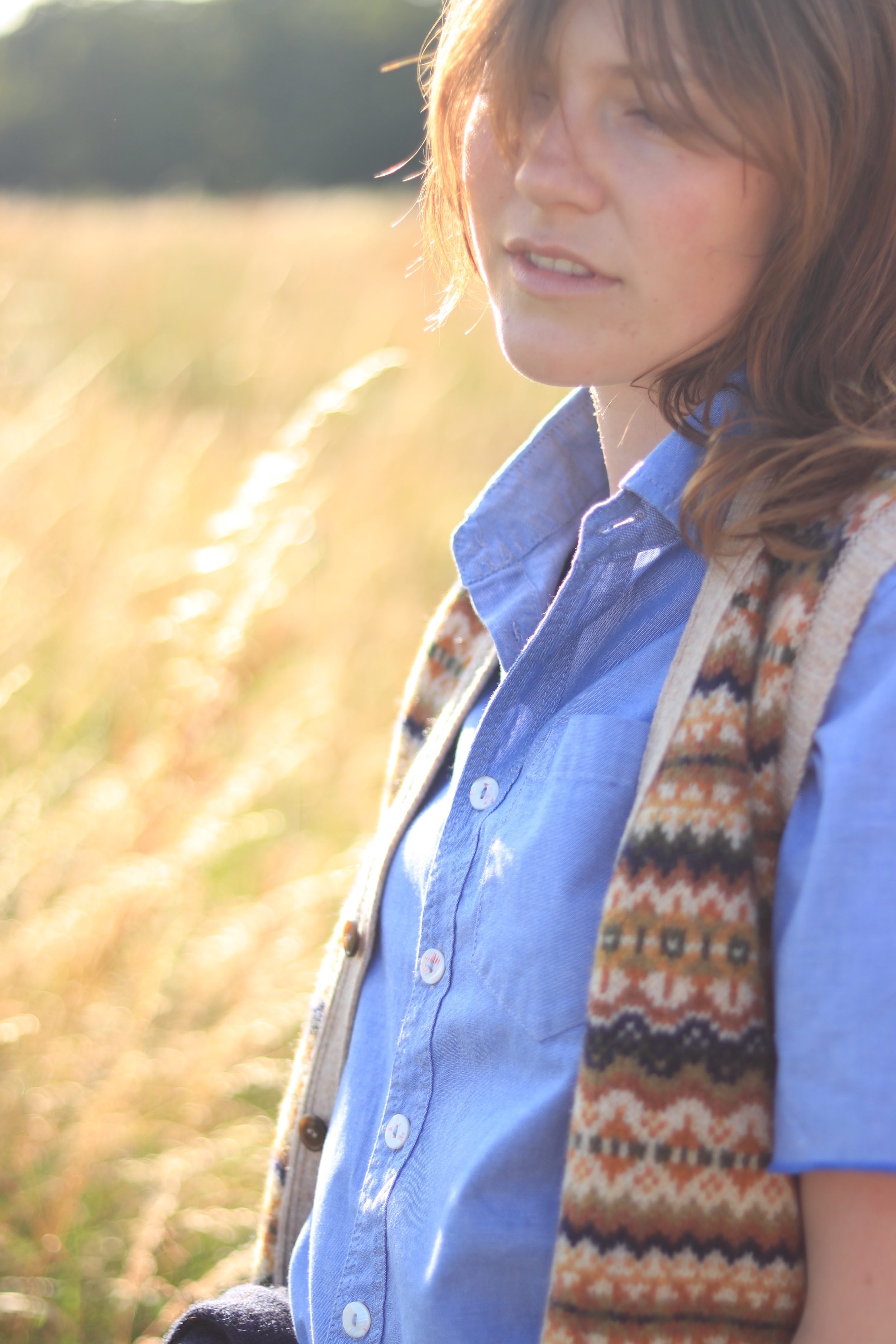 Minna wears Carrier Company Sleeveless Fair Isle Cardigan with Pinpoint Chambray Shirt