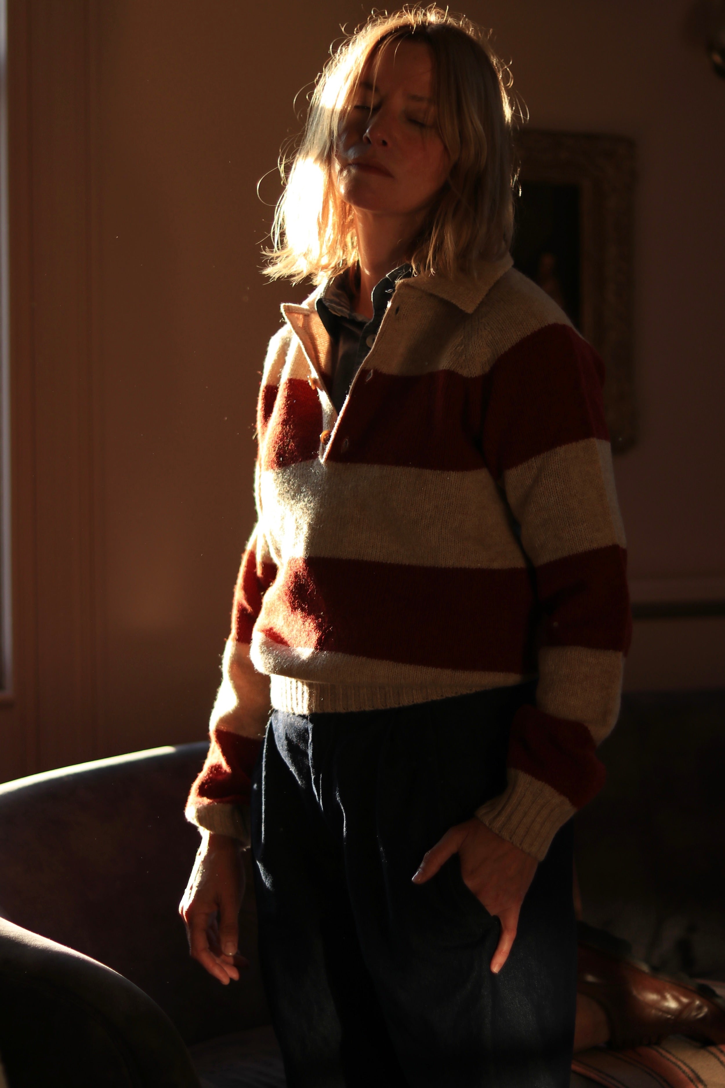 Sienna wears Carrier Company Collar Jumper in Tusk and Blaze