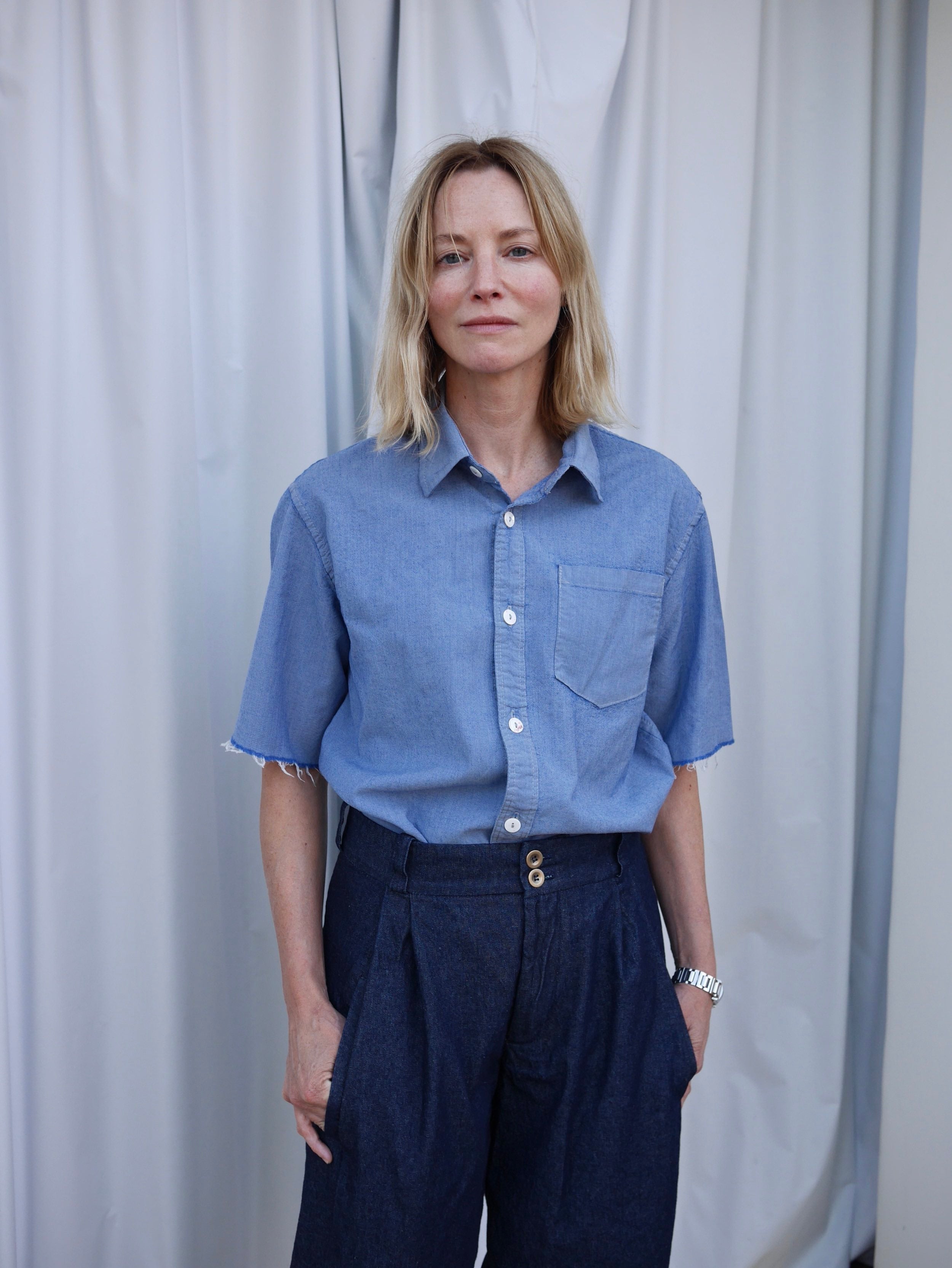 SIenna wears Carrier Company Dutch Trousers in Denim with Pinpoint Chambray Shirt