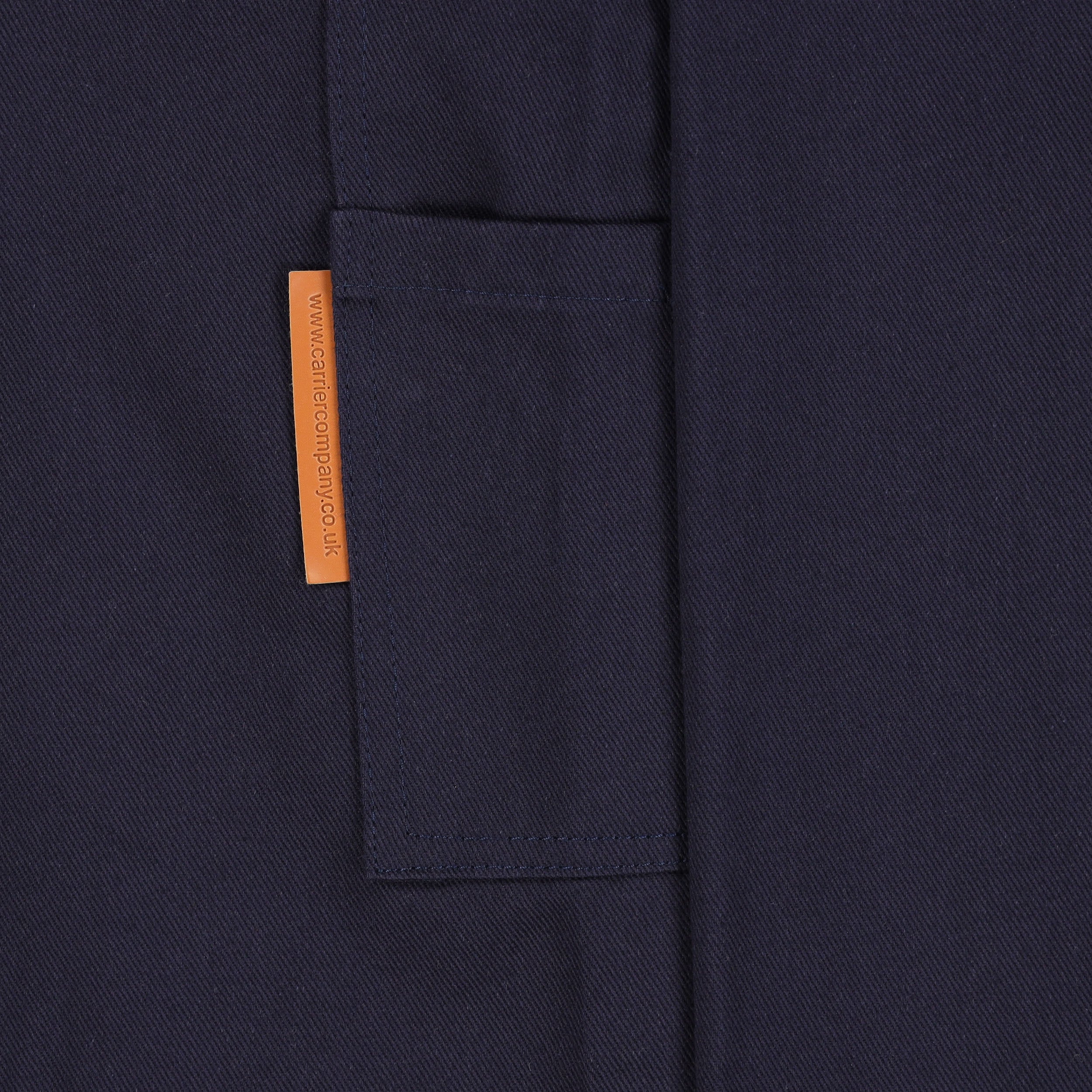 Close up of the pocket detail of the navy Carrier Company Men's Dungarees