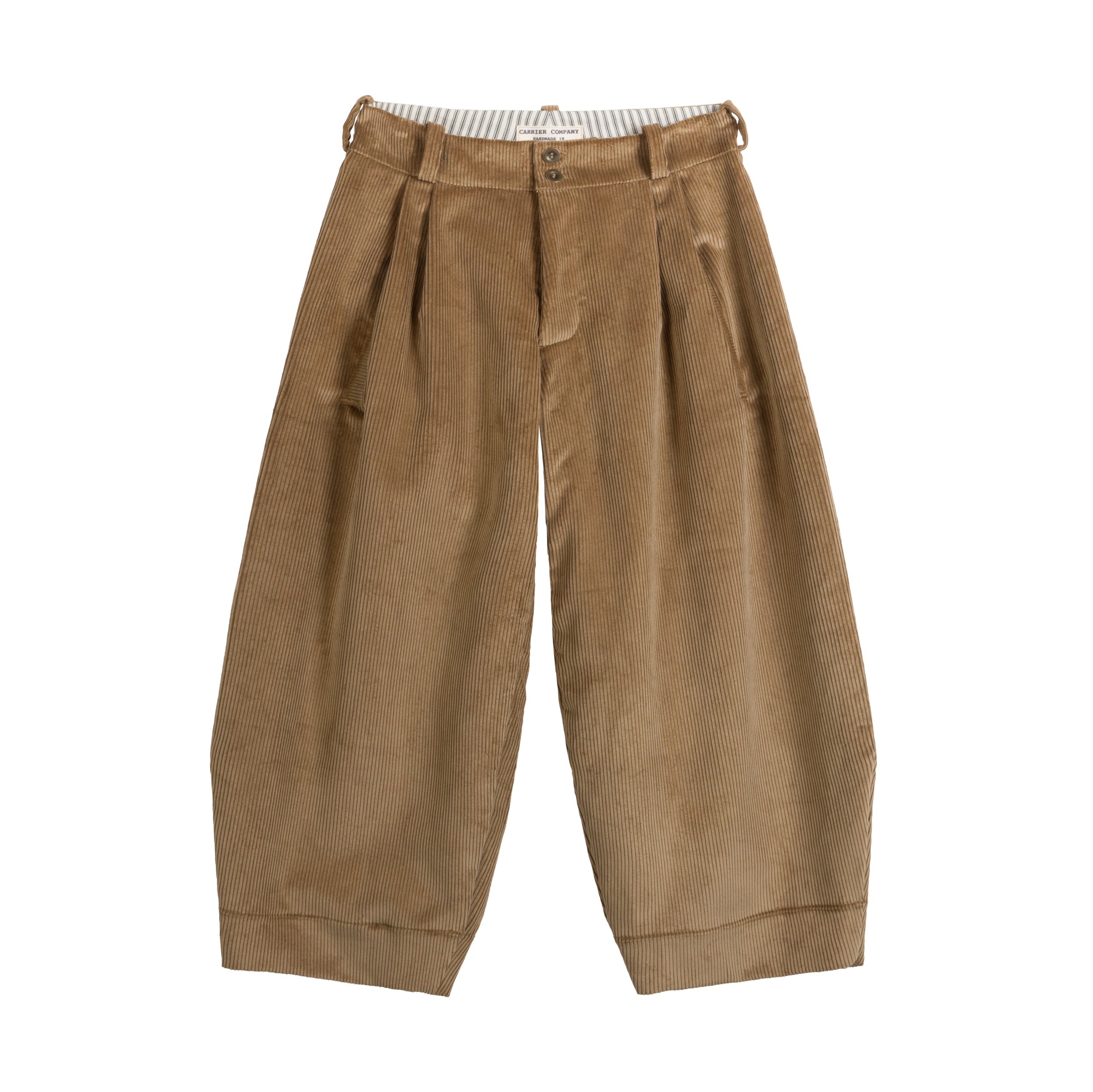 Women's trousers in soft heavy sand coloured corduroy. The trousers have soft pleats at the front to flatter the tummy, they are wide legged with a tapered hem but very roomy.