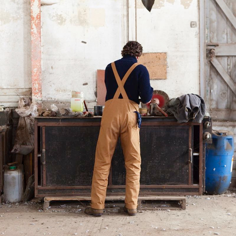 Man wearing Tan Dungarees with Navy Fisherman Jumper