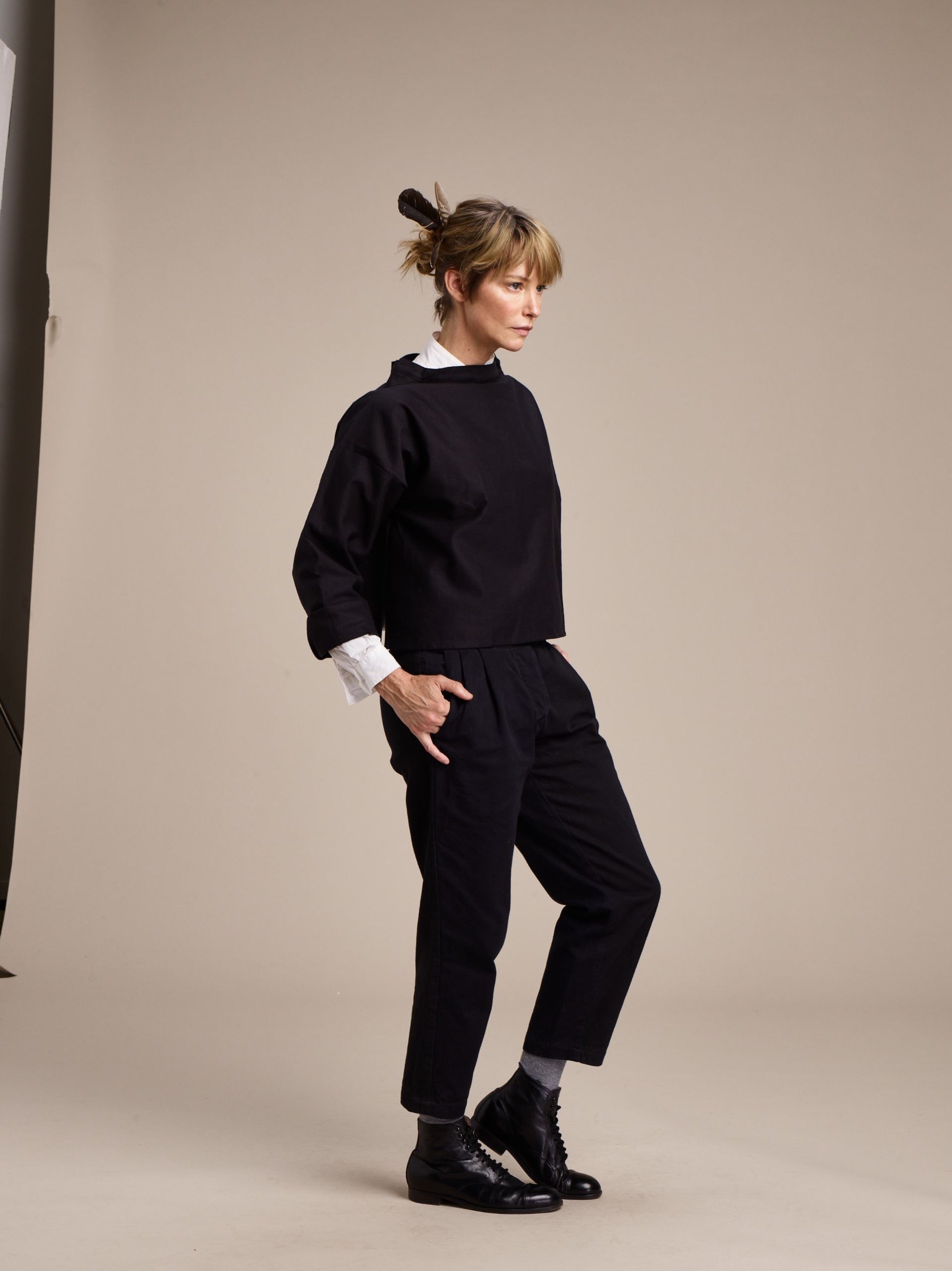 Woman wears Carrier Company Cropped Trouser in Black with Black Cropped Smock