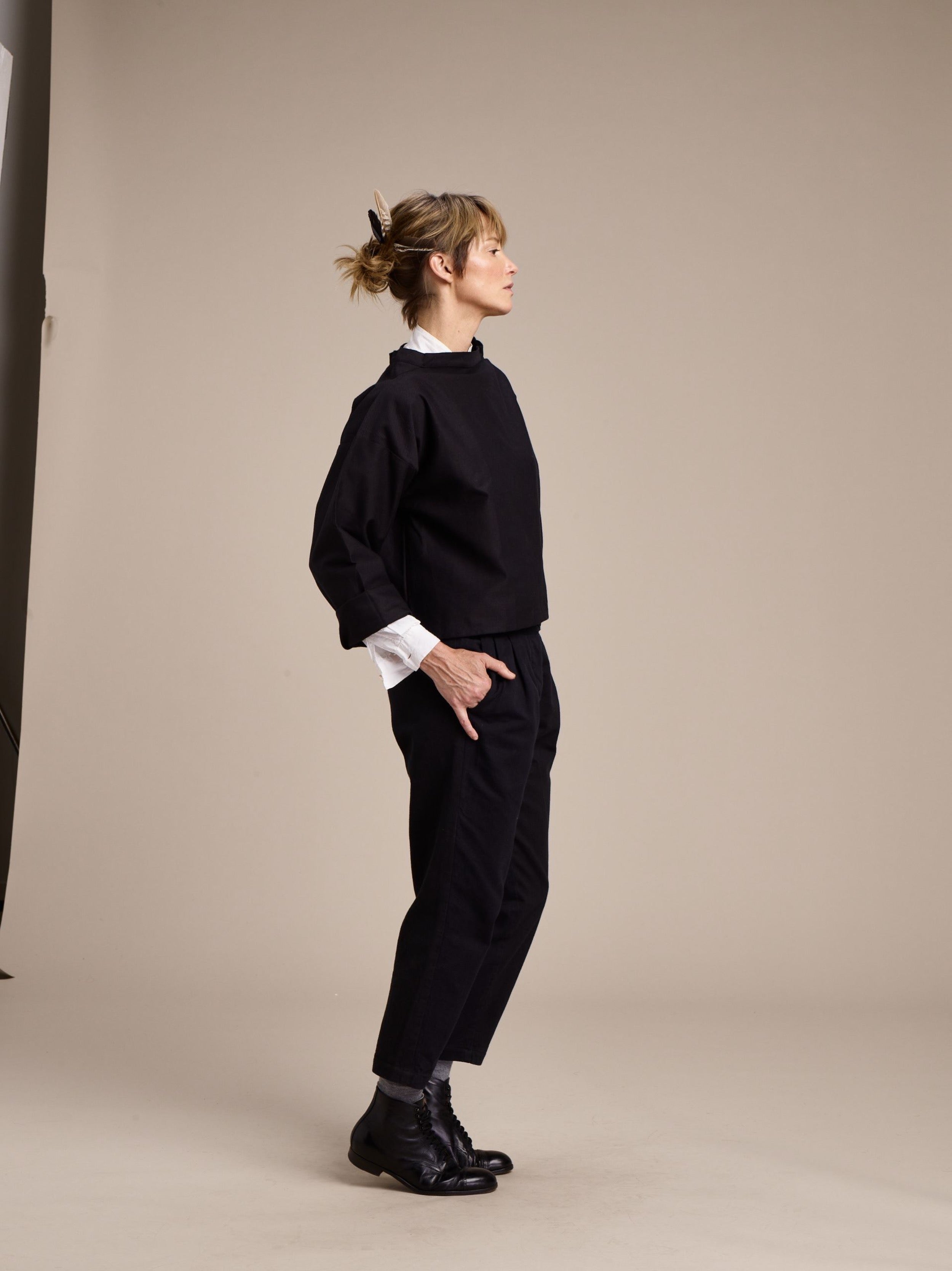 Woman wears Carrier Company Cropped Trouser in Black with Black Cropped Smock