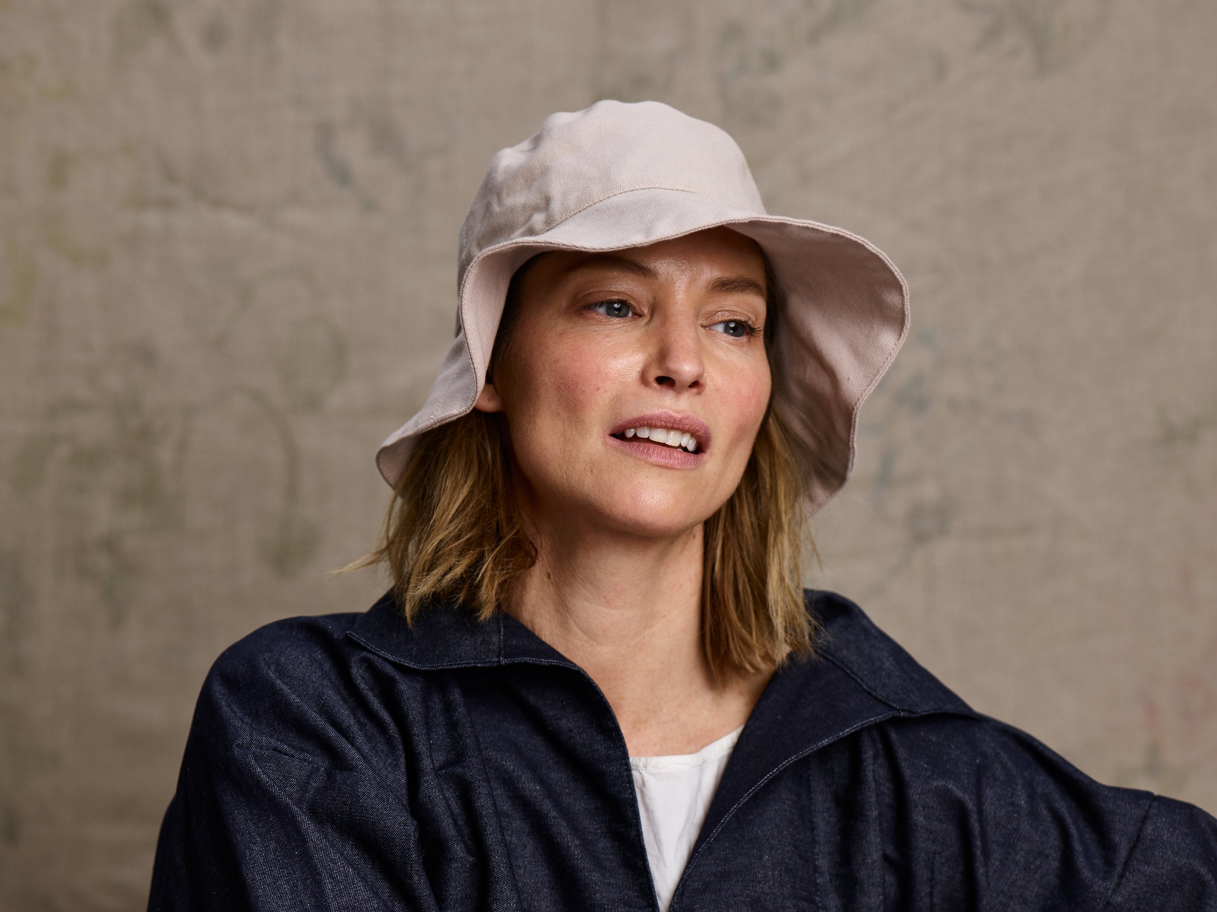 Woman wearing Carrier Company Cotton Sun Hat with Denim V-Neck Smock