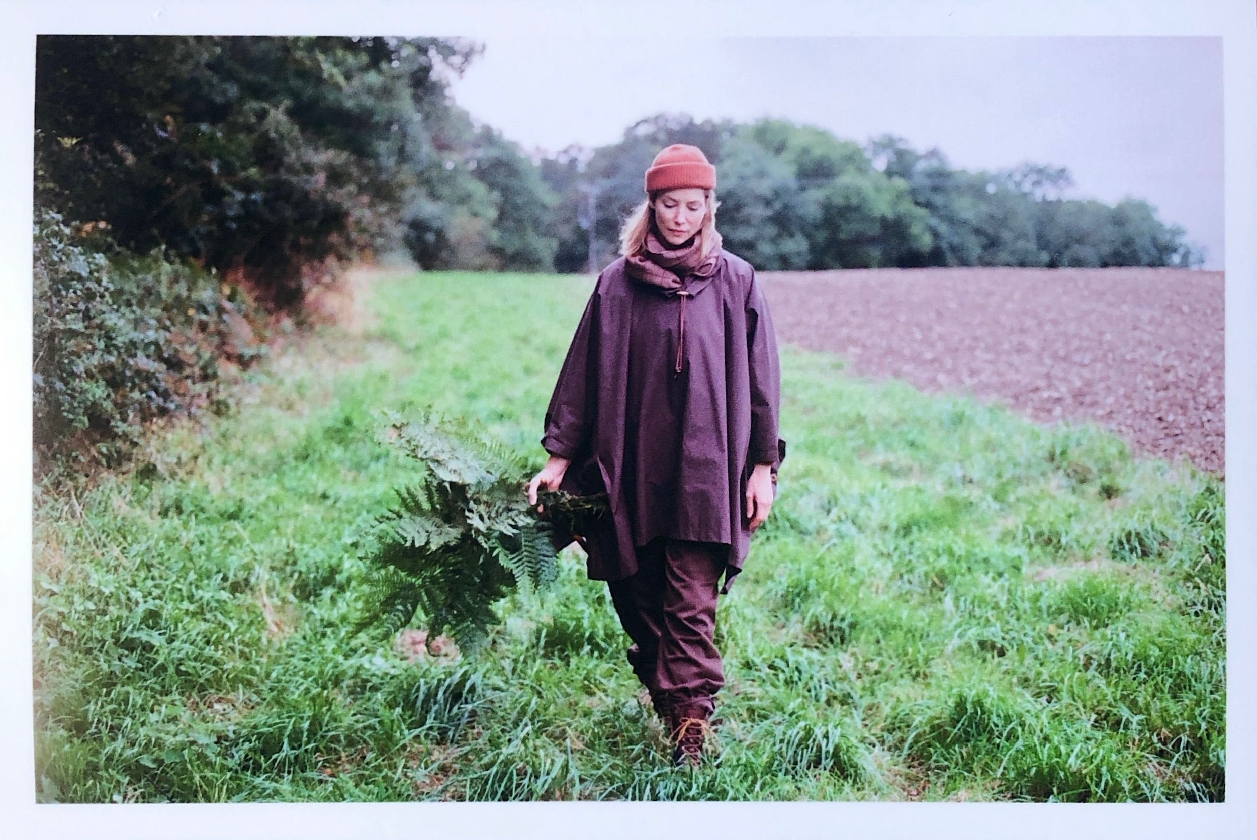 Woman wearing Carrier Company Rain Cape with Wool Hat and Short Scarf