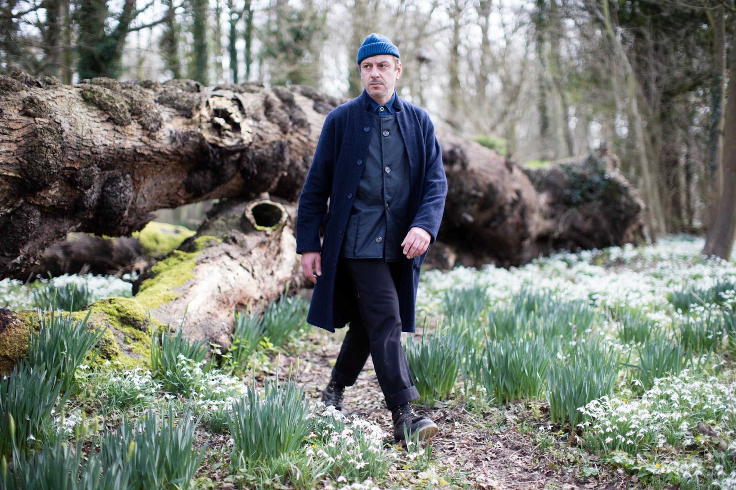 Man wearing Carrier Company Norfolk Jerkin in Navy with Wool Coat and Wool Hat