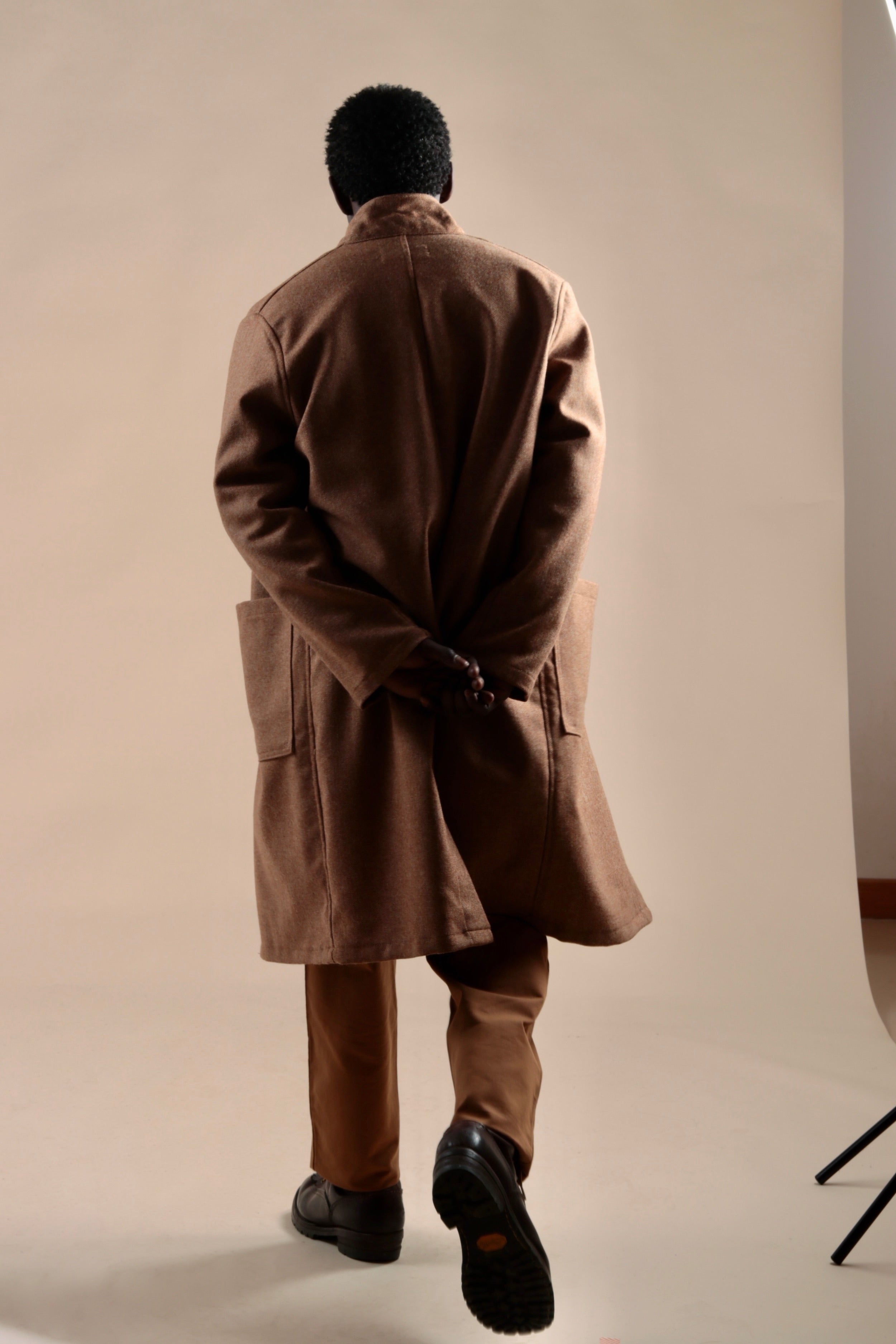 Man wears Carrier Company Tan Herringbone Wool Coat with Classic Trouser
