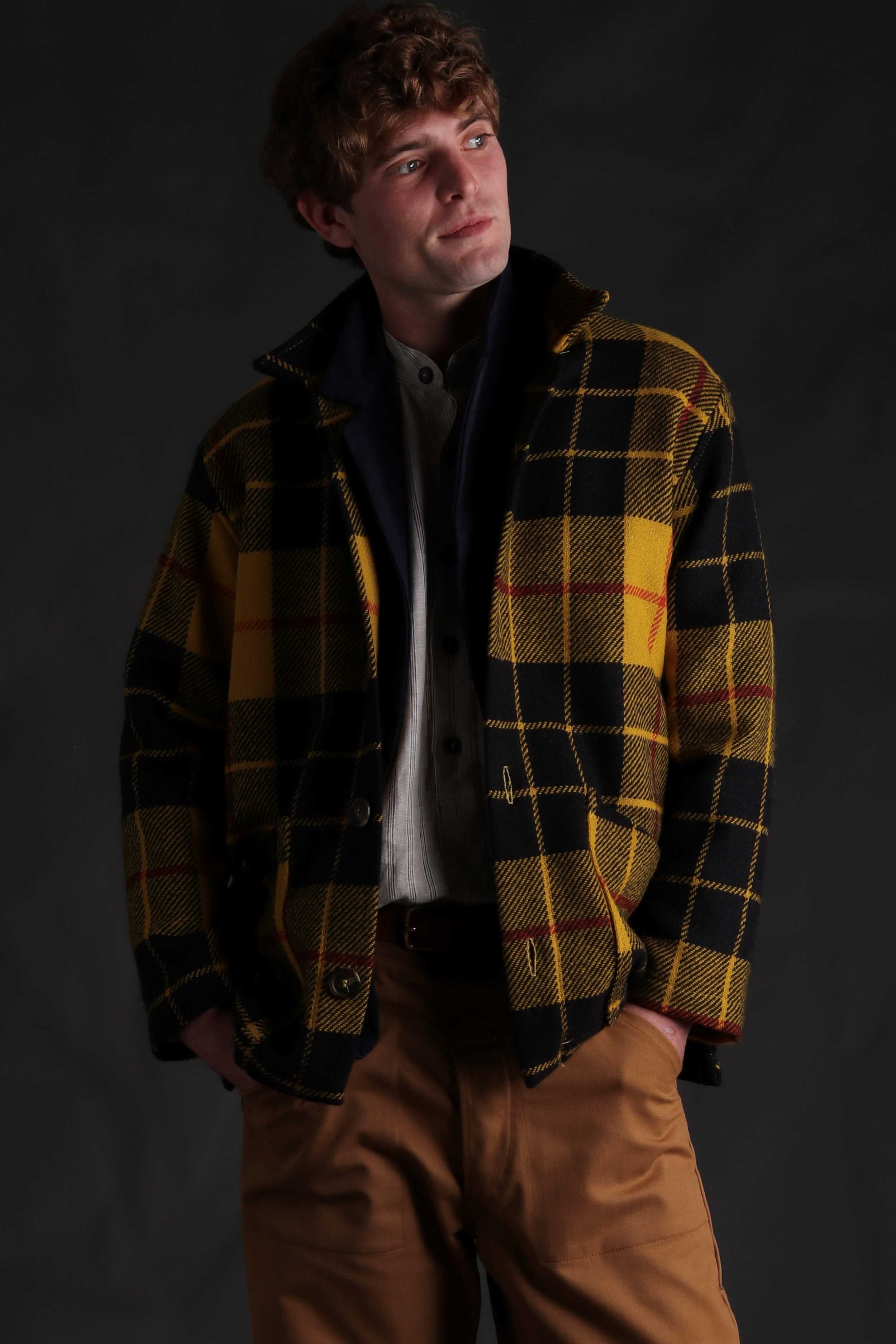 Man wearing Celtic Wool Jacket in Yellow with Mens Work Trouser in Tan