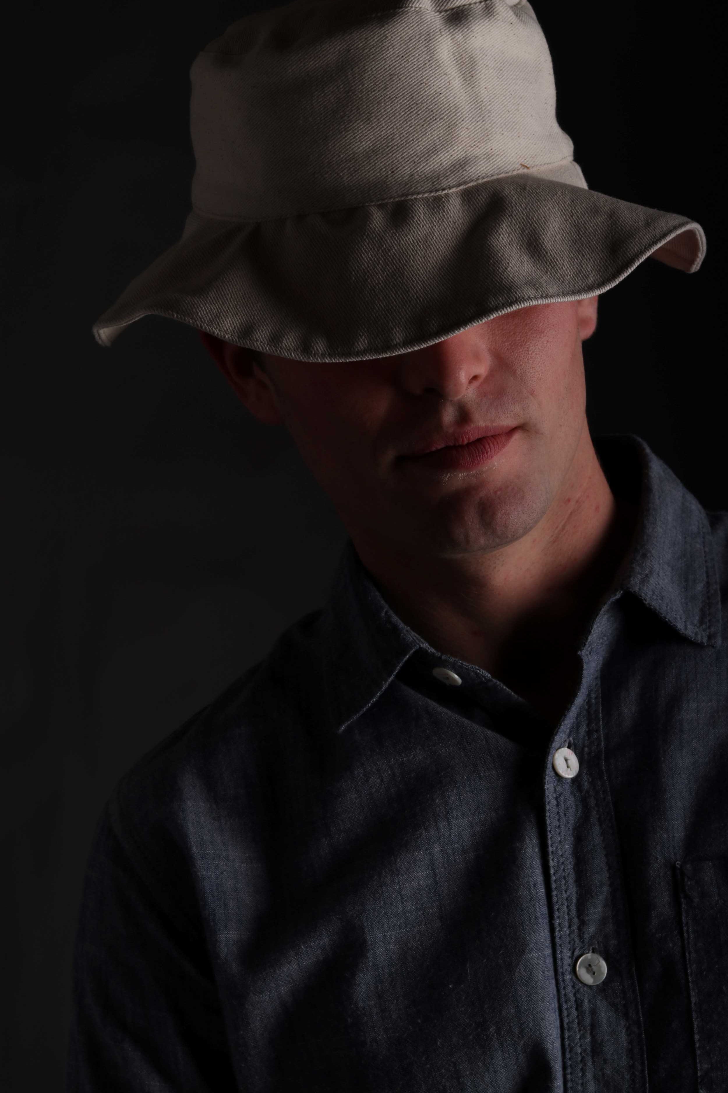 Man wearing Carrier Company Cotton Sun Hat