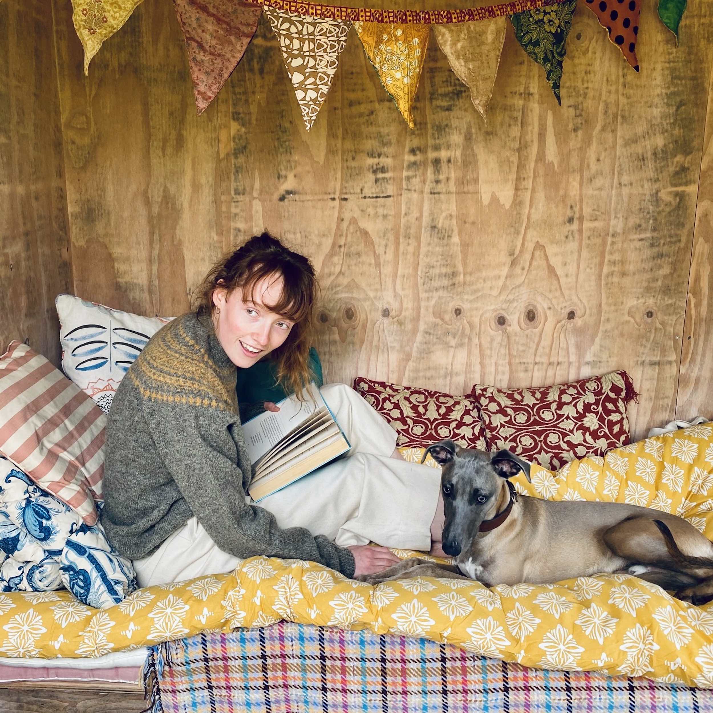 Woman wears Carrier Company Yoke Shetland Lambswool Jumper in Oyster & Cumin and Dutch Trouser in Seeded Denim