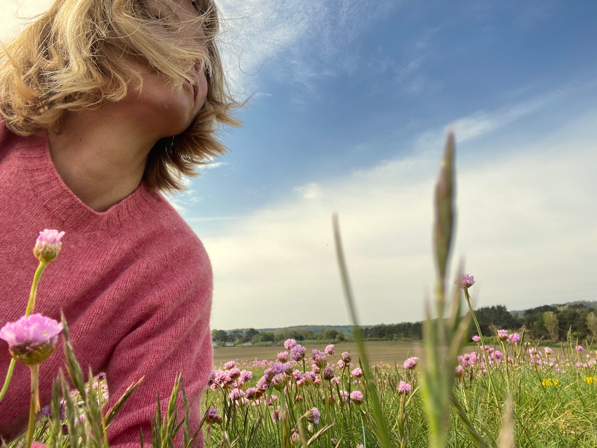 Woman wears Carrier Company Shetland Lambswool Jumper in Salmon