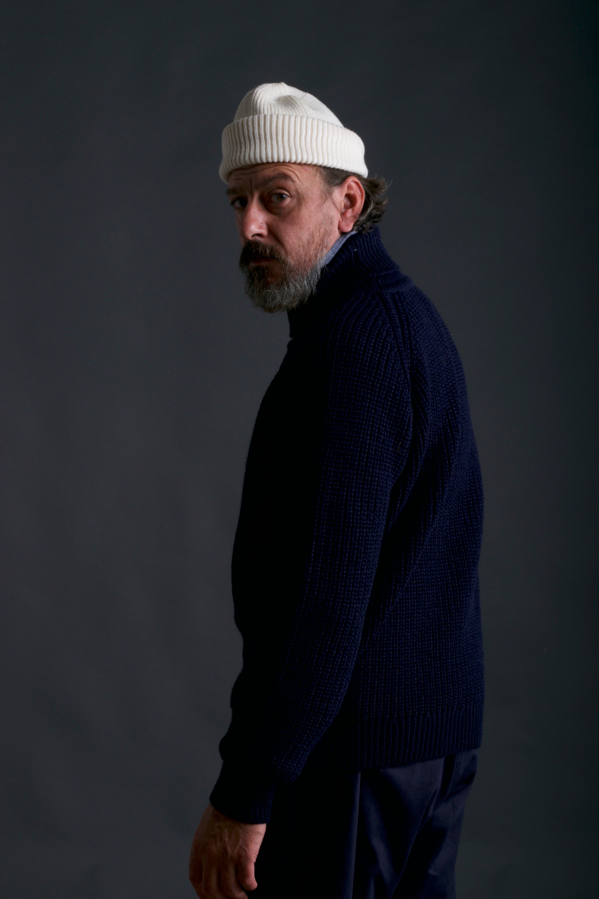 Man wears Carrier Company Fisherman's Jumper with Grandpa Shorts and Wool Hat