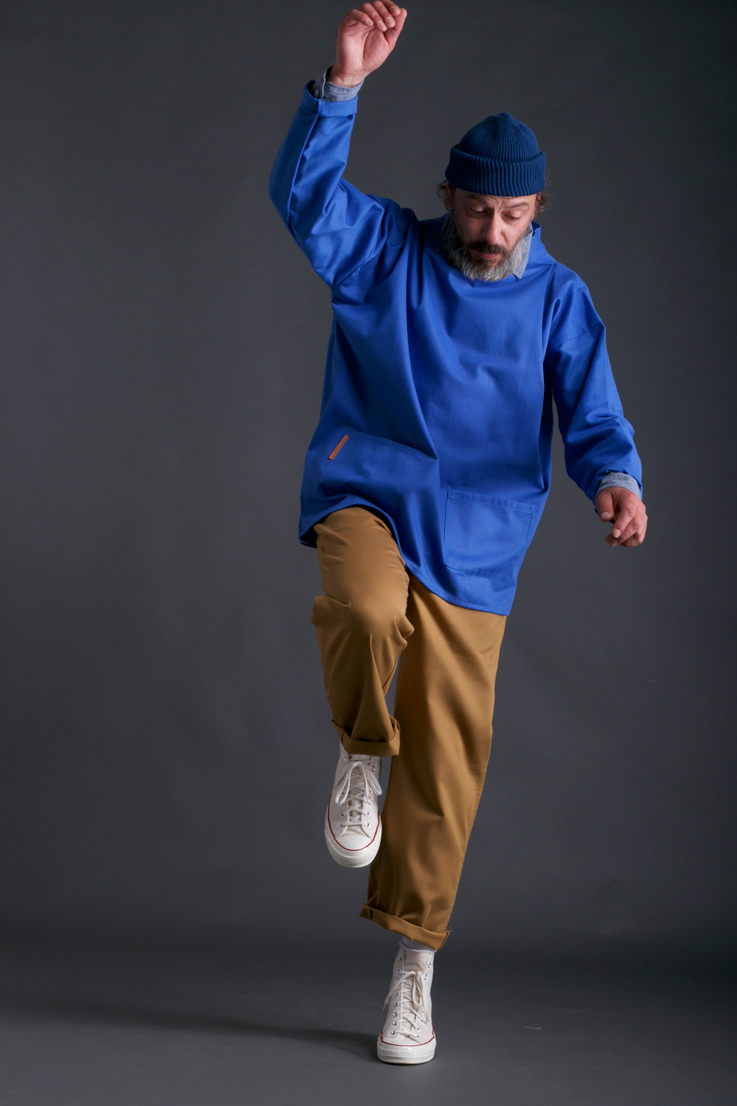 Man wears Carrier Company Traditional Norfolk Slop in Sky Blue with classic Trouser, Chambray Shirt and Wool Hat in Petrol Blue