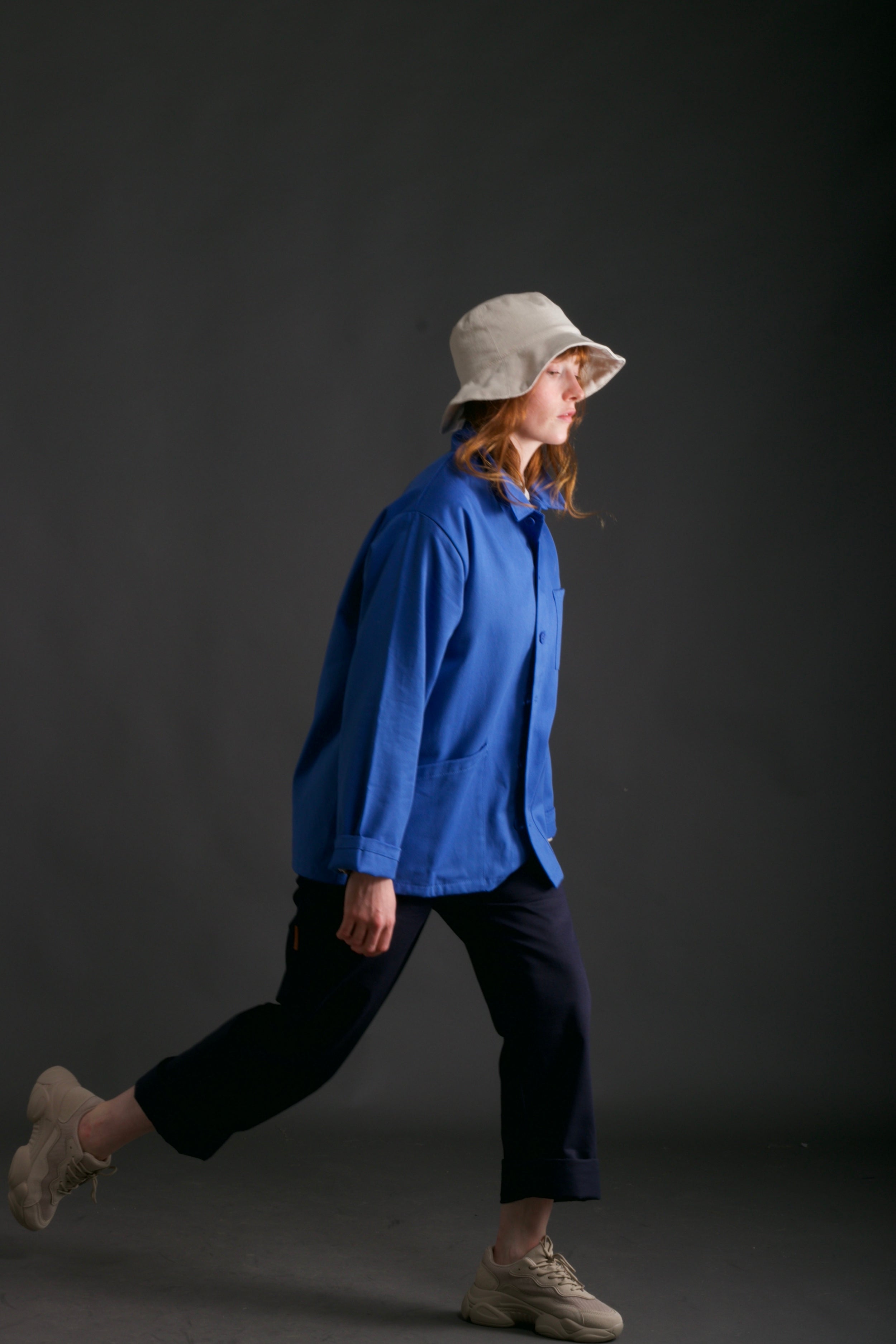 Woman wears Carrier Company Traditional Work Jacket in Sky Blue