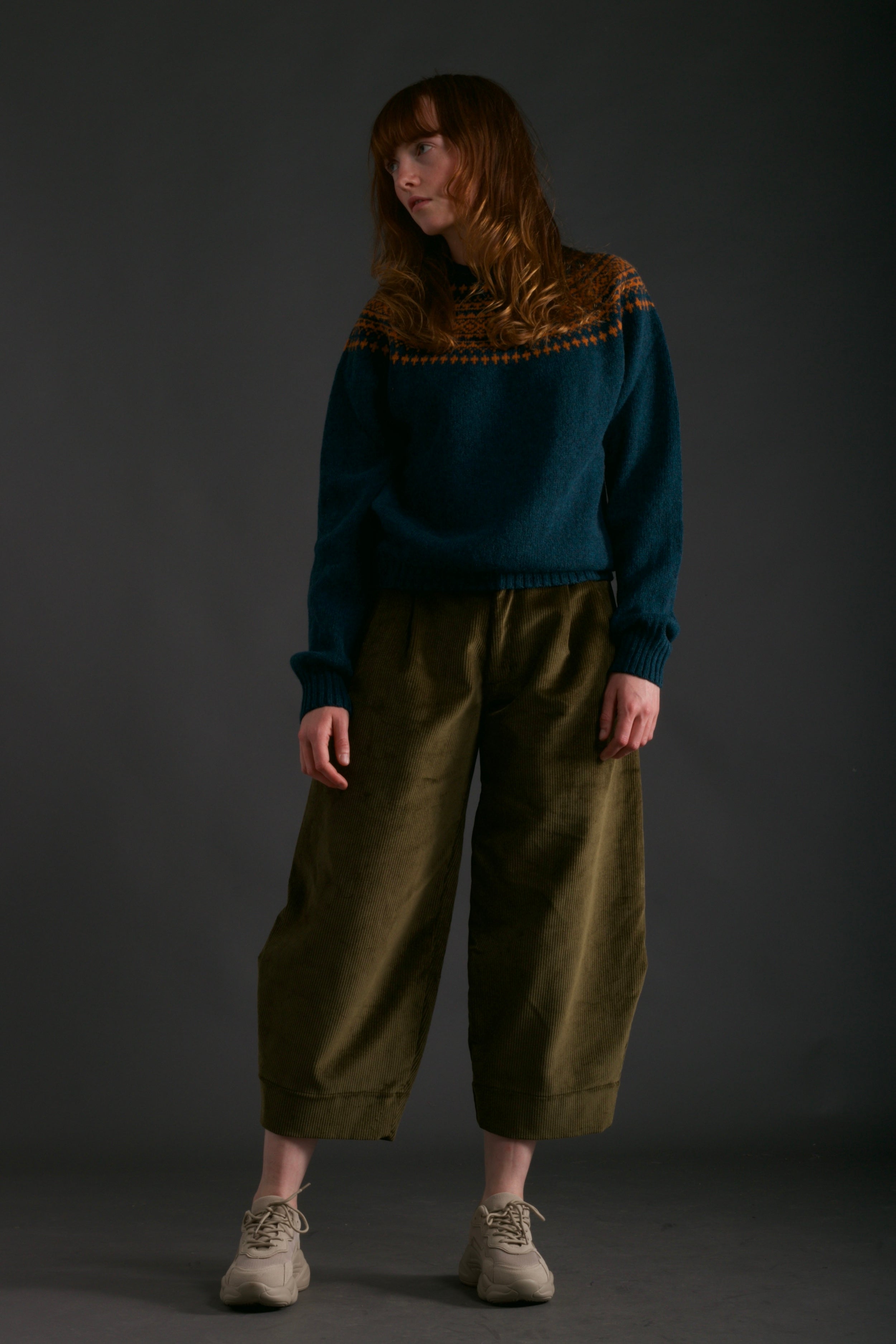 Woman wears Carrier Company Dutch Trouser in Corduroy with Yoke Shetland Lambswool Jumper