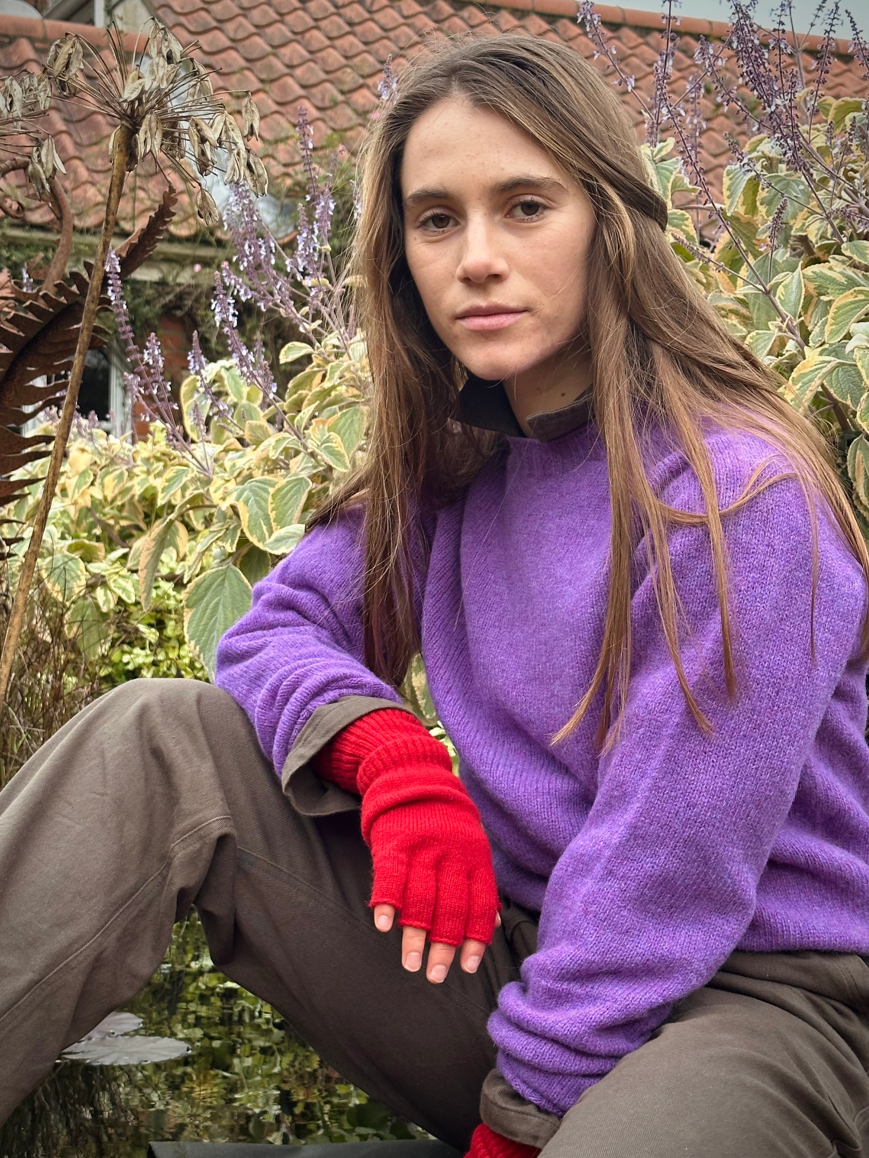 Decca wears Carrier Company Shetland Lambswool Jumper in Allium with Gathering Glove