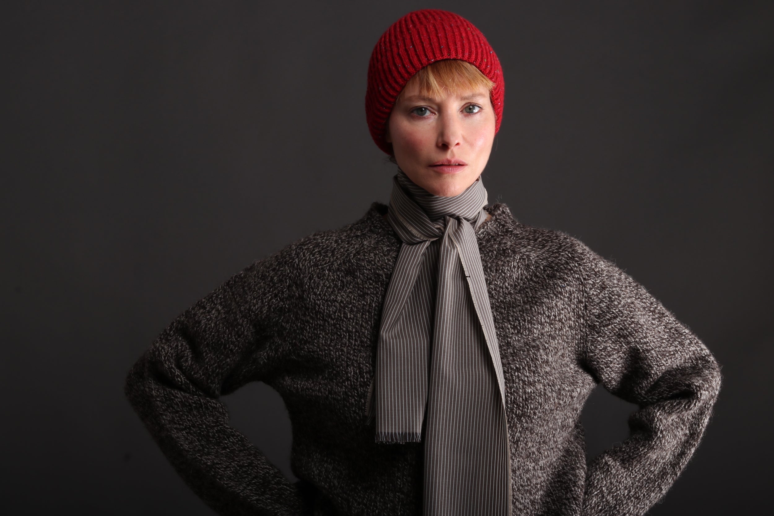 Woman wearing Carmine Donegal Wool Hat with Heavy Heritage Breed Lambswool Jumper in Jacob