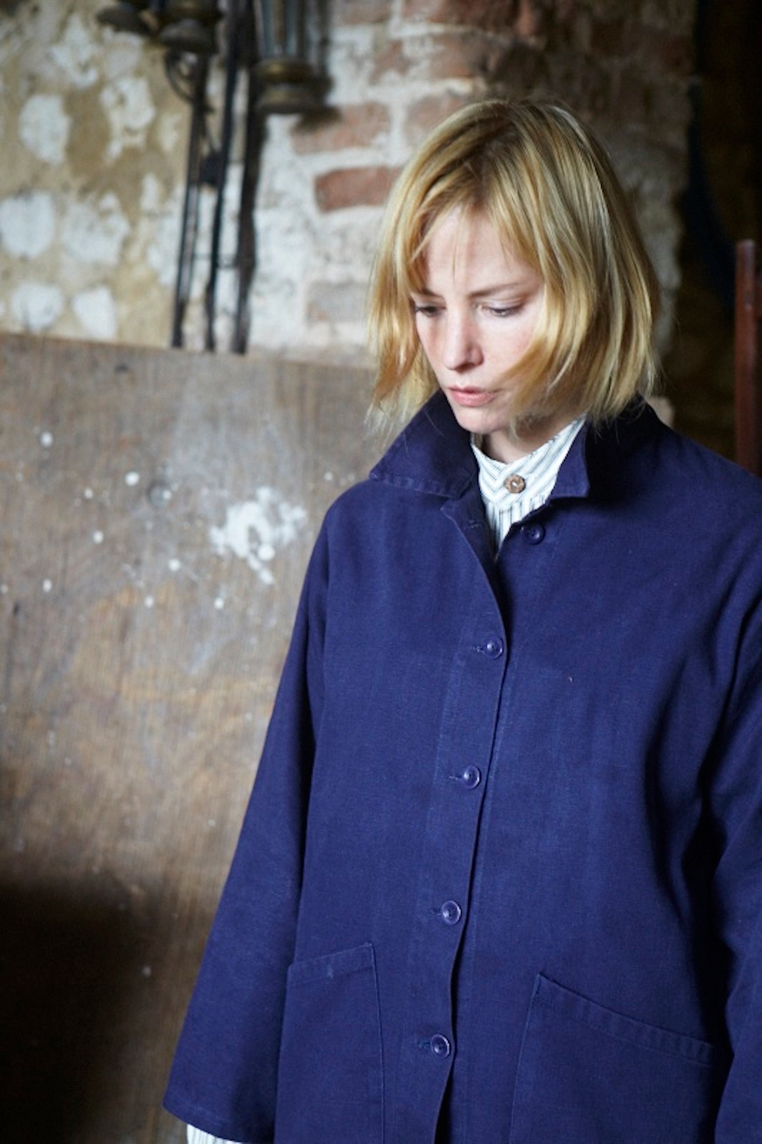 Woman wearing Carrier Company Traditional Norfolk Work Jacket in Navy and Collarless Work Shirt